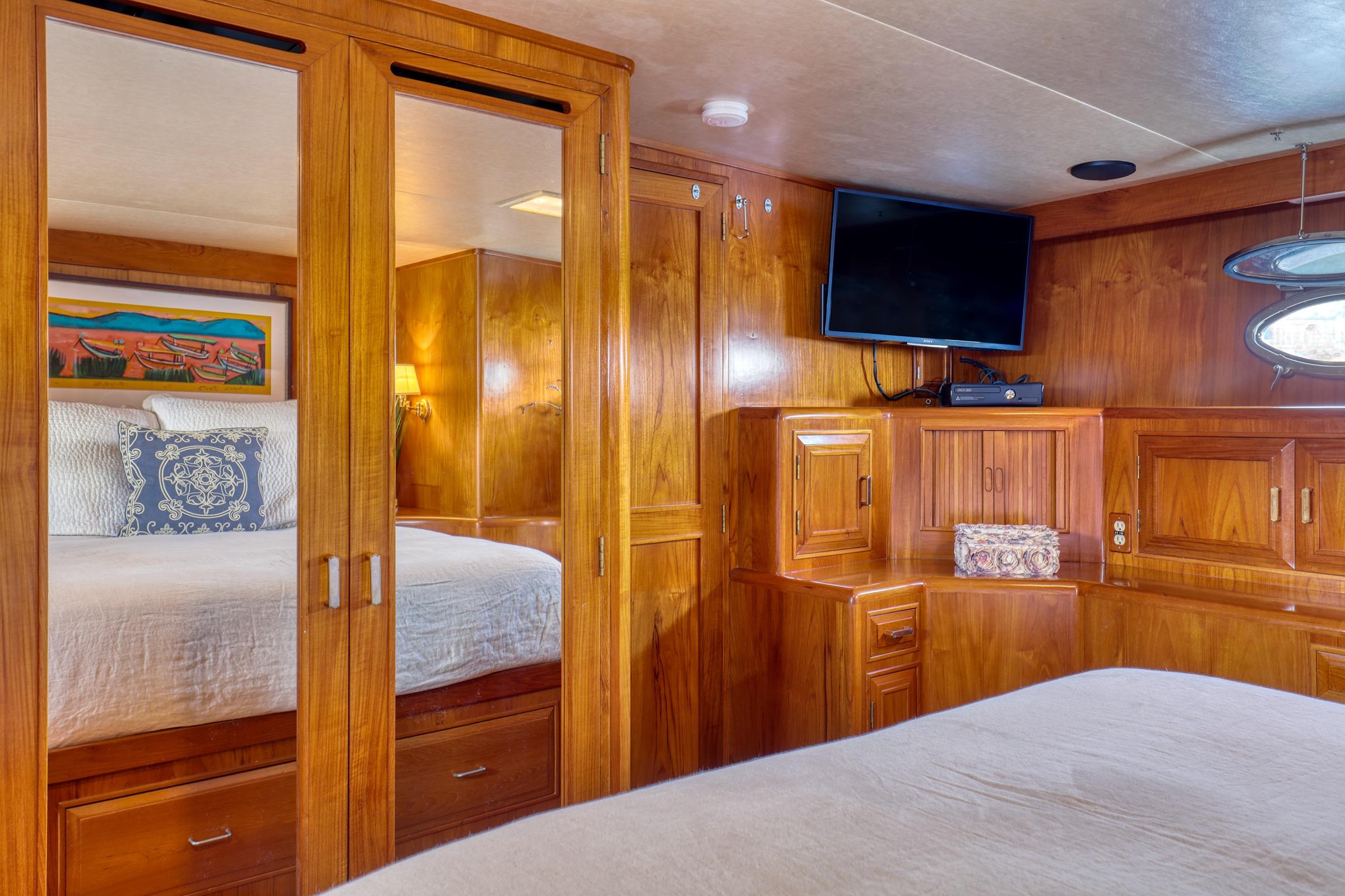 Luxurious 1987 Ocean Alexander 480 Sport Sedan cabin with wood paneling and modern amenities.