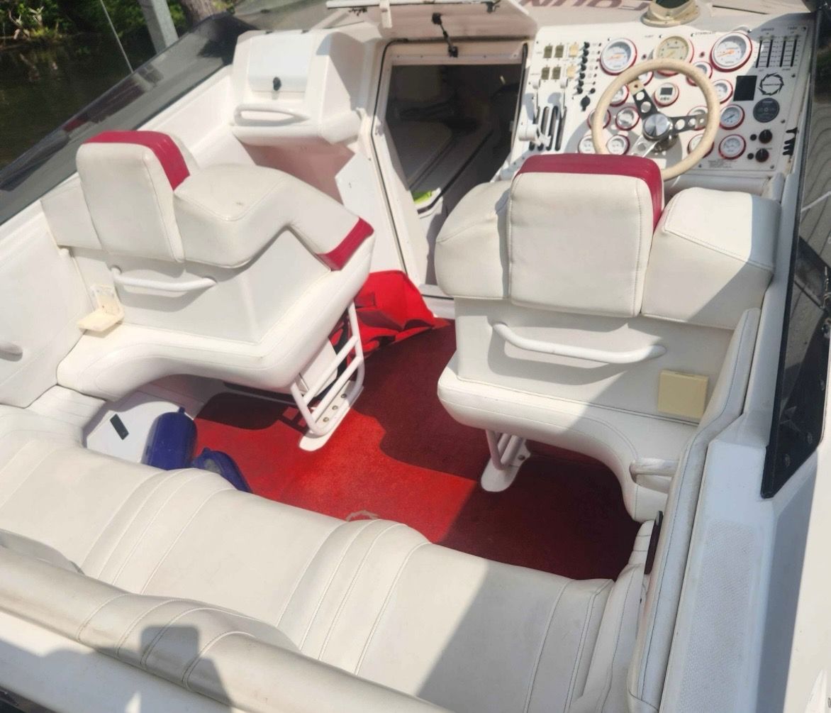 Interior of a 2000 Fountain Fever boat with white and red seats.