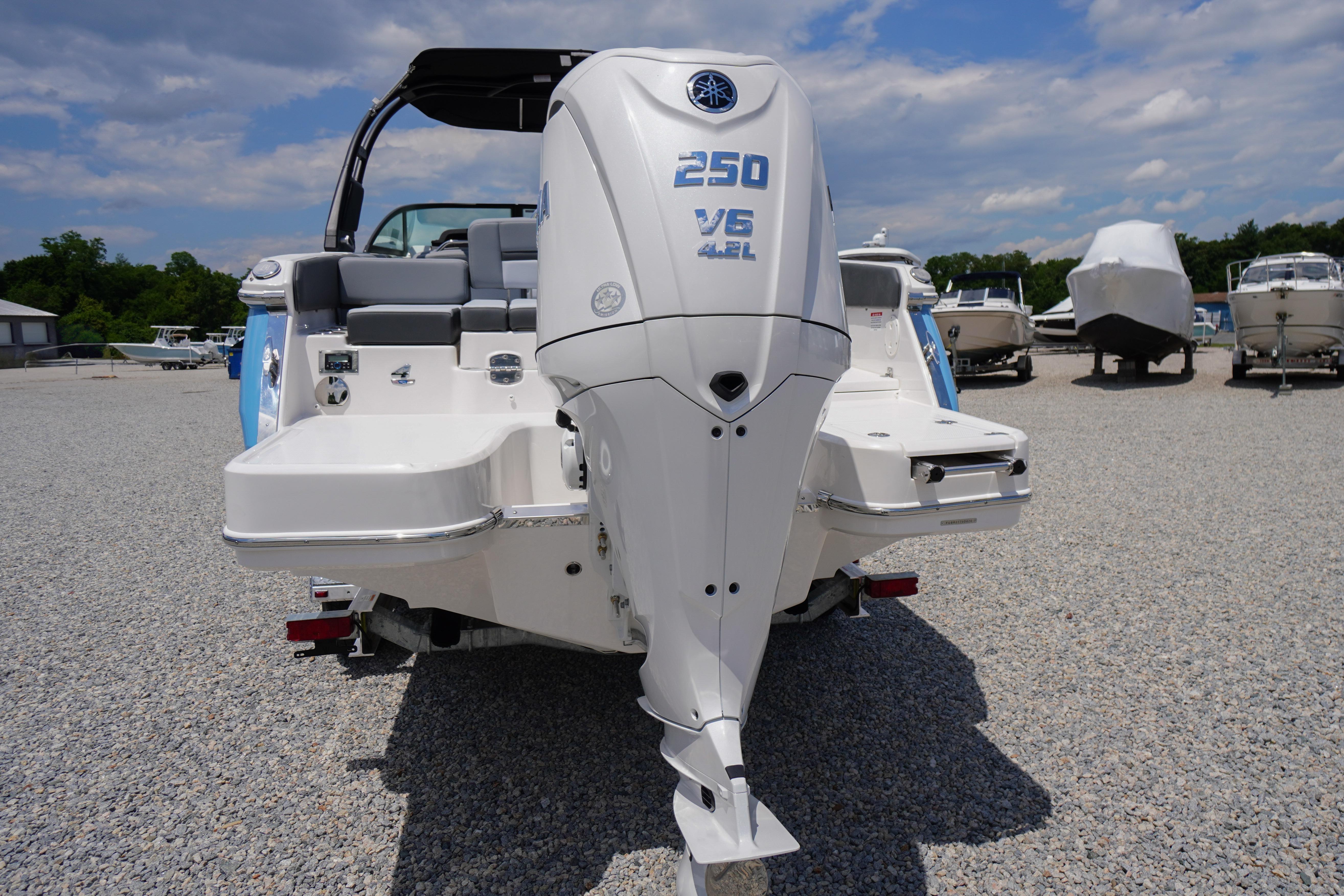2026 Chaparral SSX 4 boat with Yamaha 250 V6 engine in a marina setting.