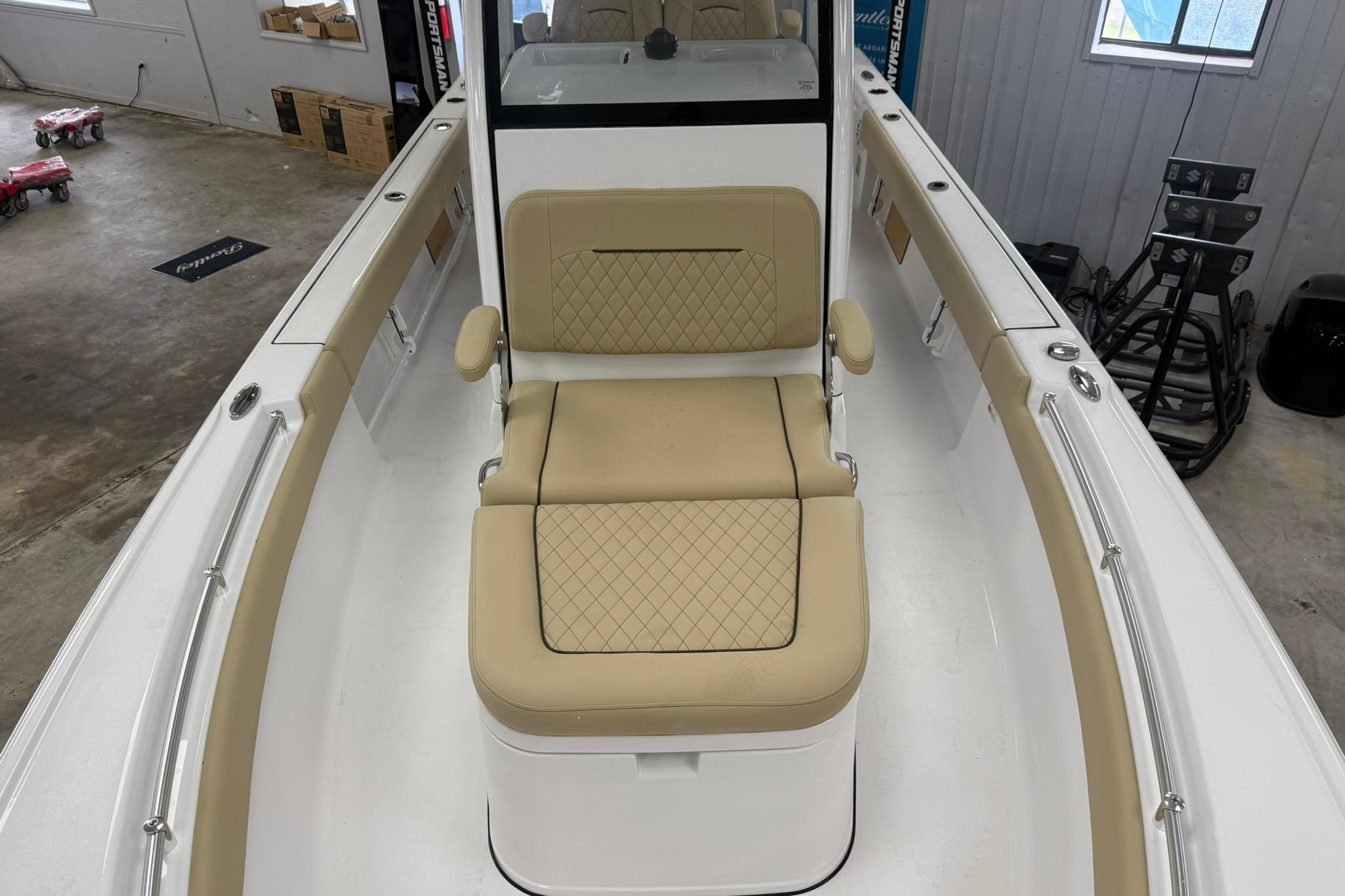 2026 Sportsman Masters 247OE Bay Boat interior with beige seating and armrests.