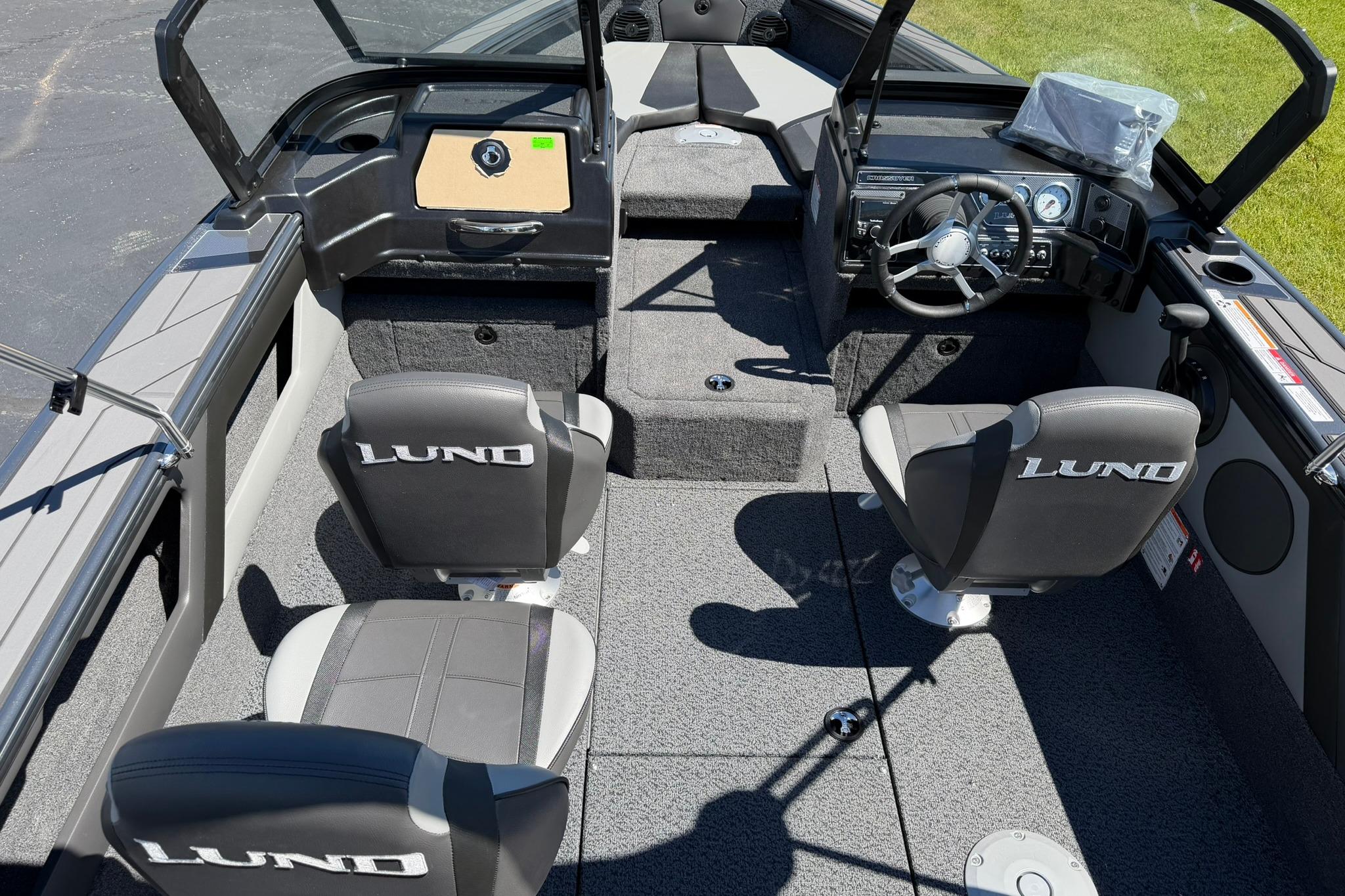 2027 Lund 1775 Crossover XS boat interior with steering wheel and seating.