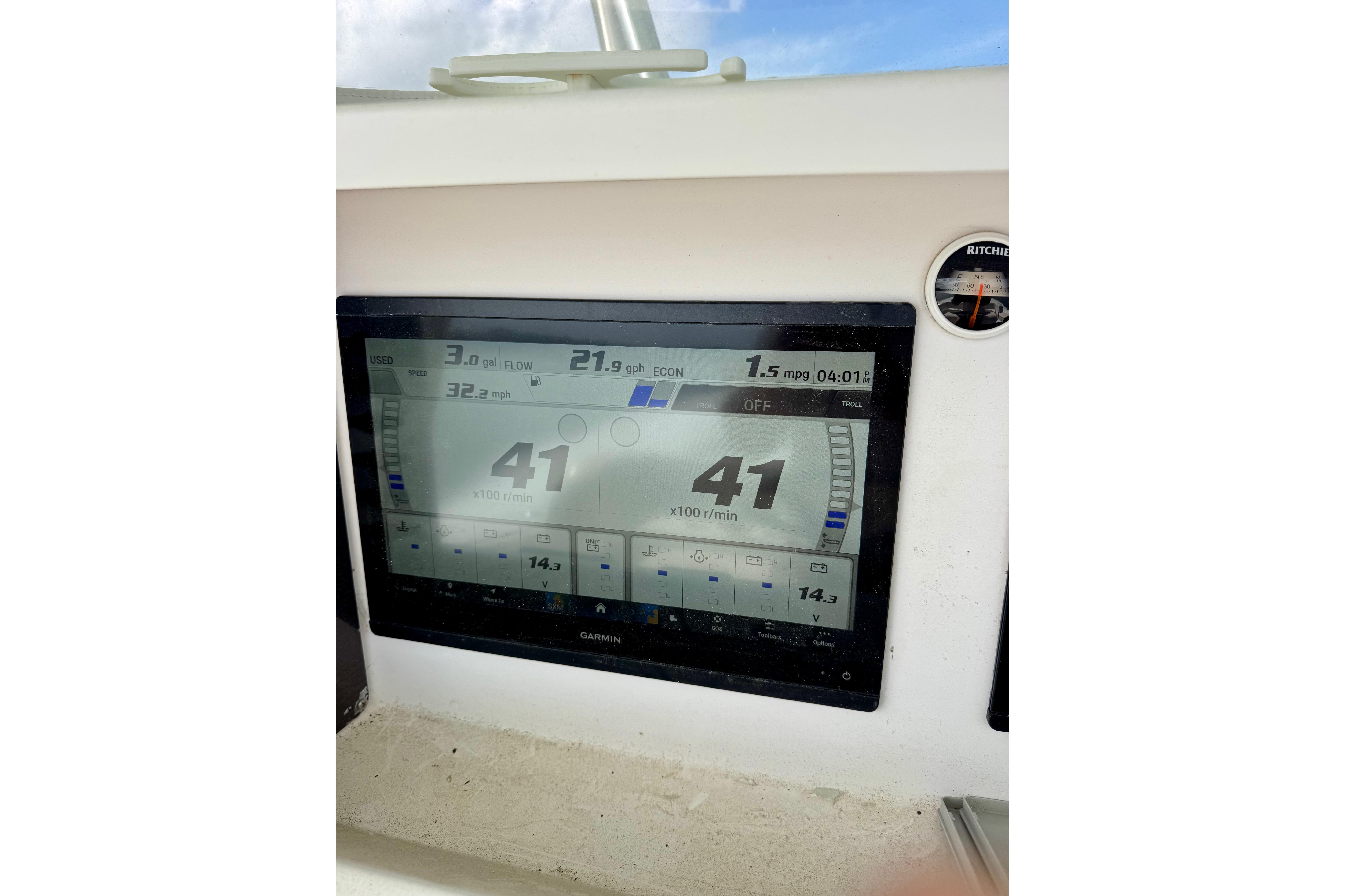 Garmin marine display on 2010 Venture 34 Tournament boat dashboard, showing speed and fuel data.