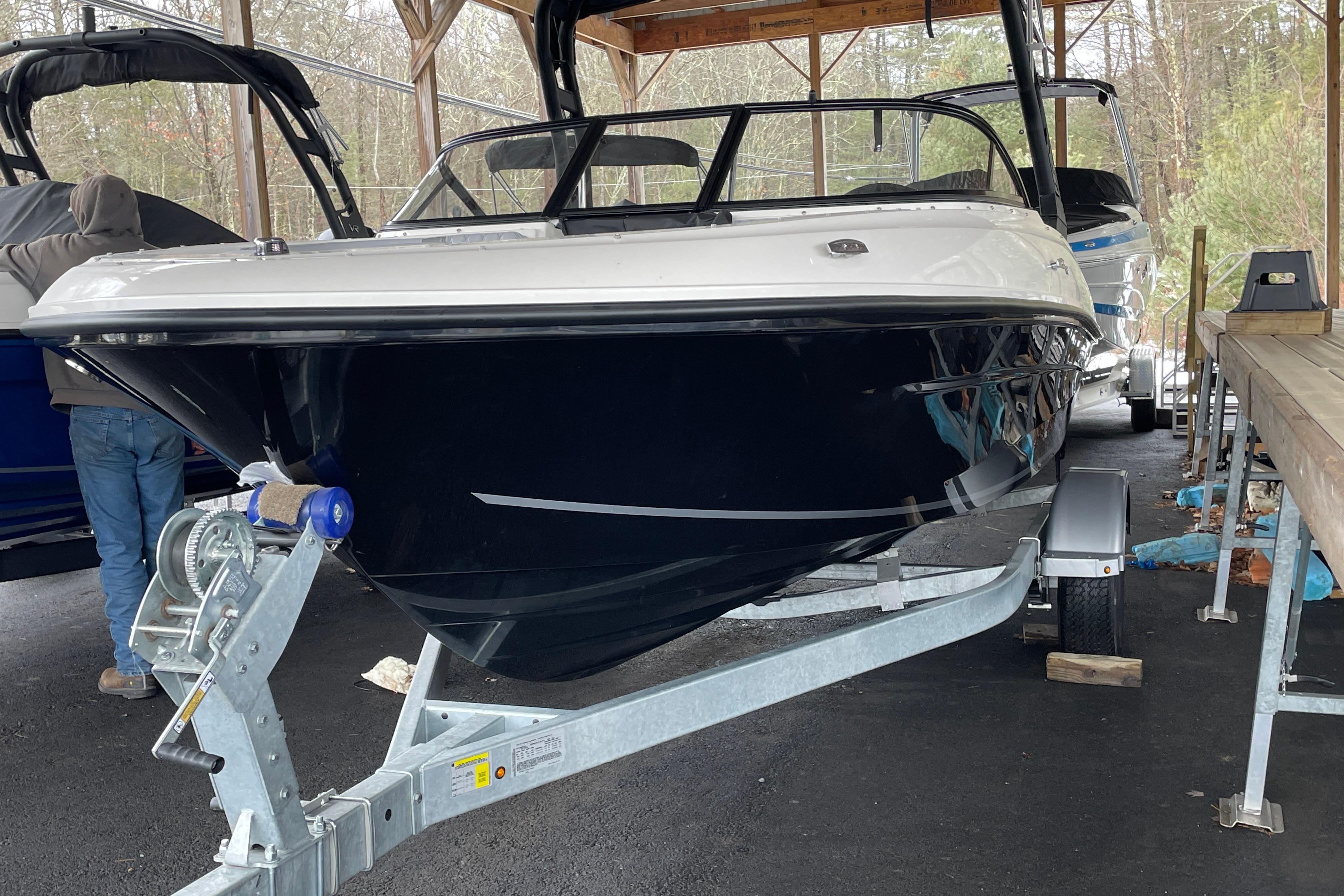 2026 Bayliner VR4 Bowrider OB on trailer in covered storage area.