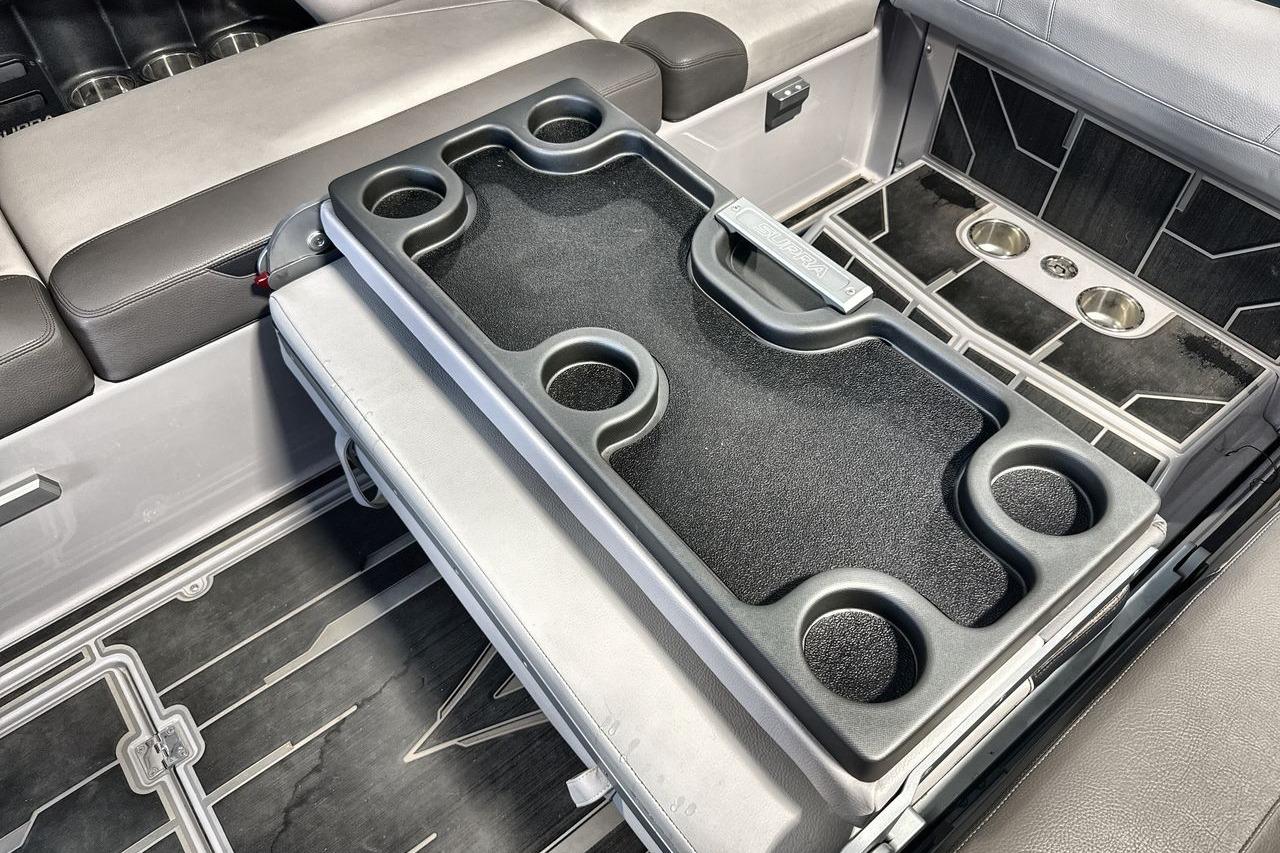 2021 Supra SE 550 interior with cup holders and seating area.
