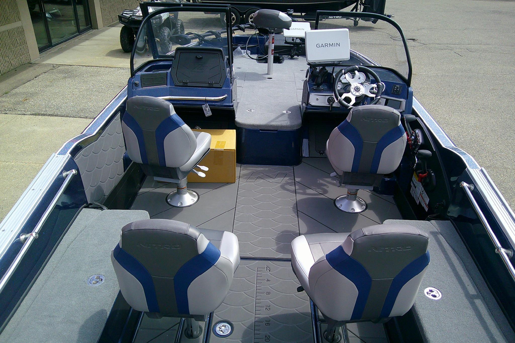 Interior of 2026 Nitro ZV21 Pro boat with Garmin navigation system and four seats.