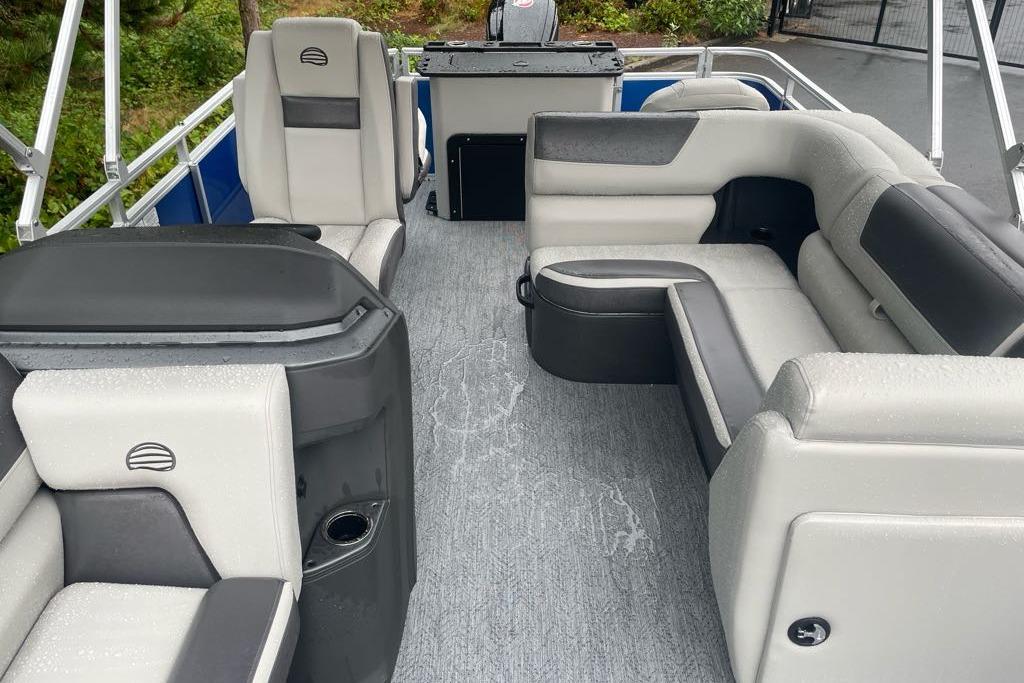 2026 Sun Tracker Fishin' Barge 20 DLX interior with gray seating and modern design.