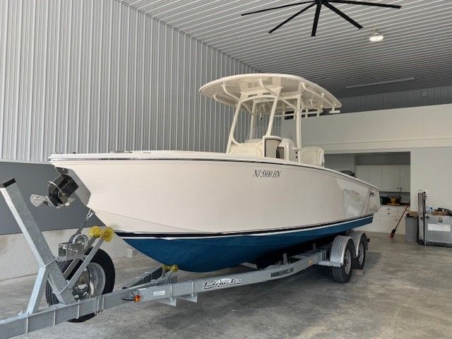 2020 Jupiter 26 FS Center Console on trailer in garage.