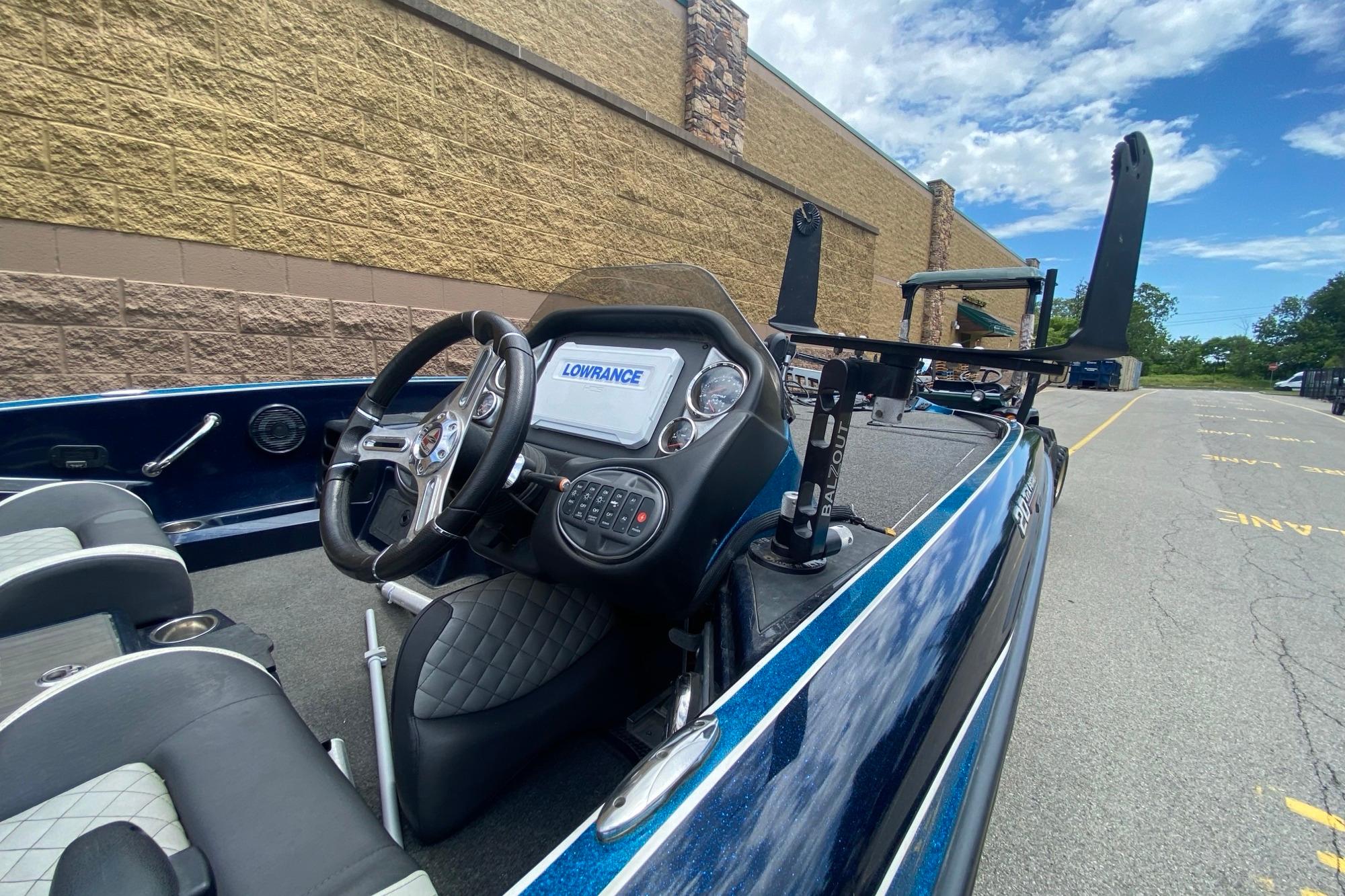 2020 Triton 20 TrX Patriot boat interior with Lowrance electronics and steering wheel.