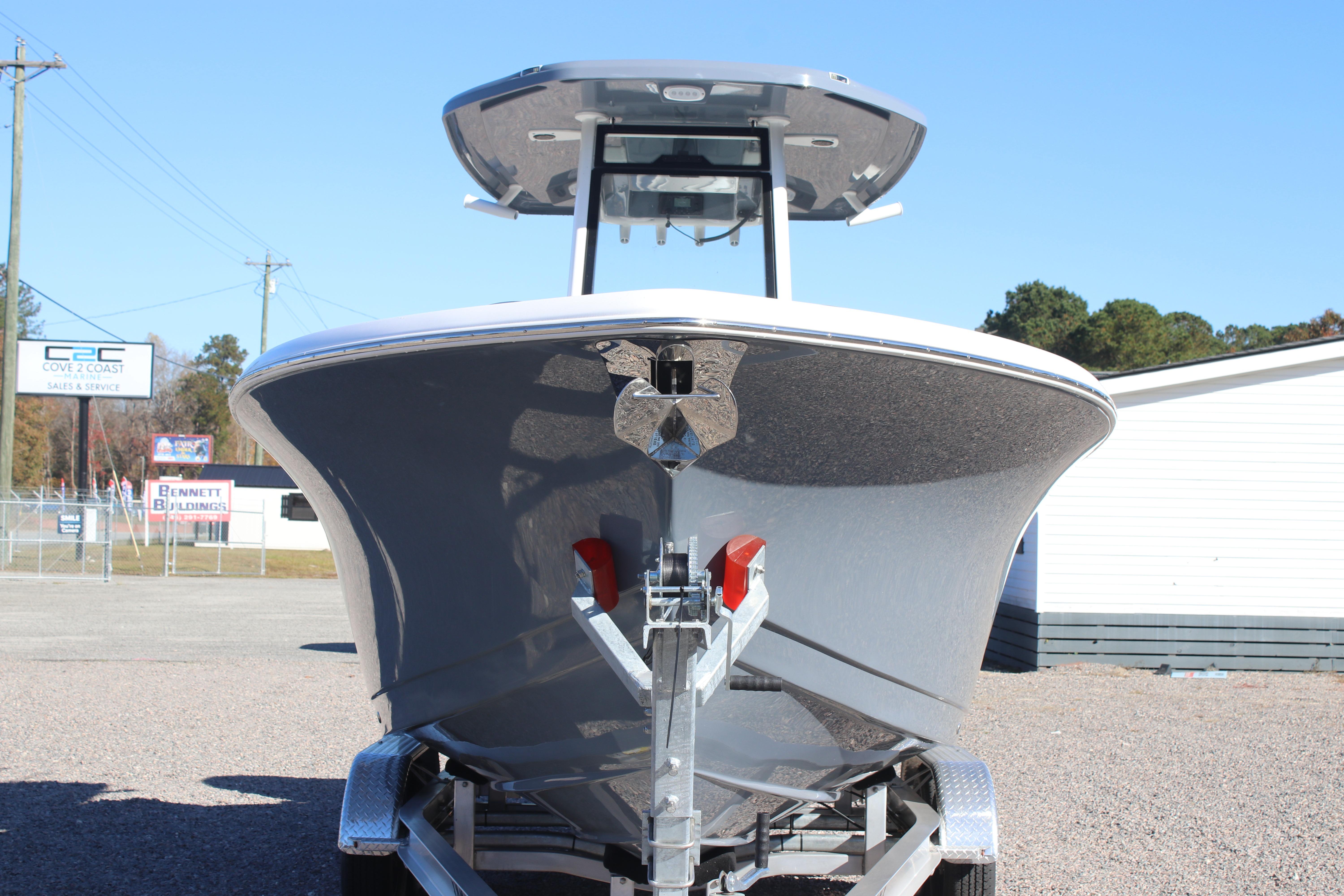 2026 Tidewater 232 CC Adventure boat on trailer, front view, outdoors.