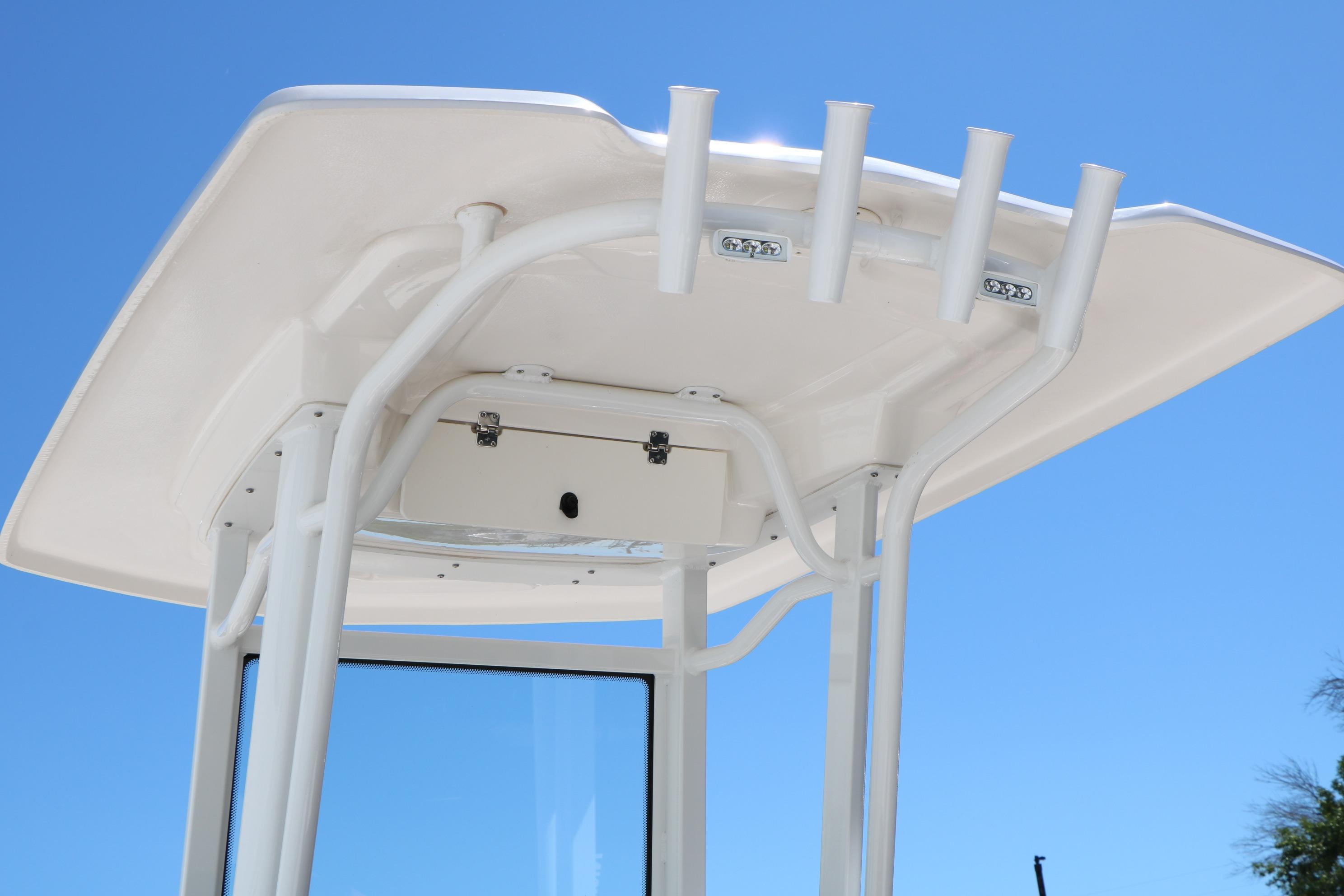 T-top of 2026 Robalo 246 Cayman boat against clear blue sky.