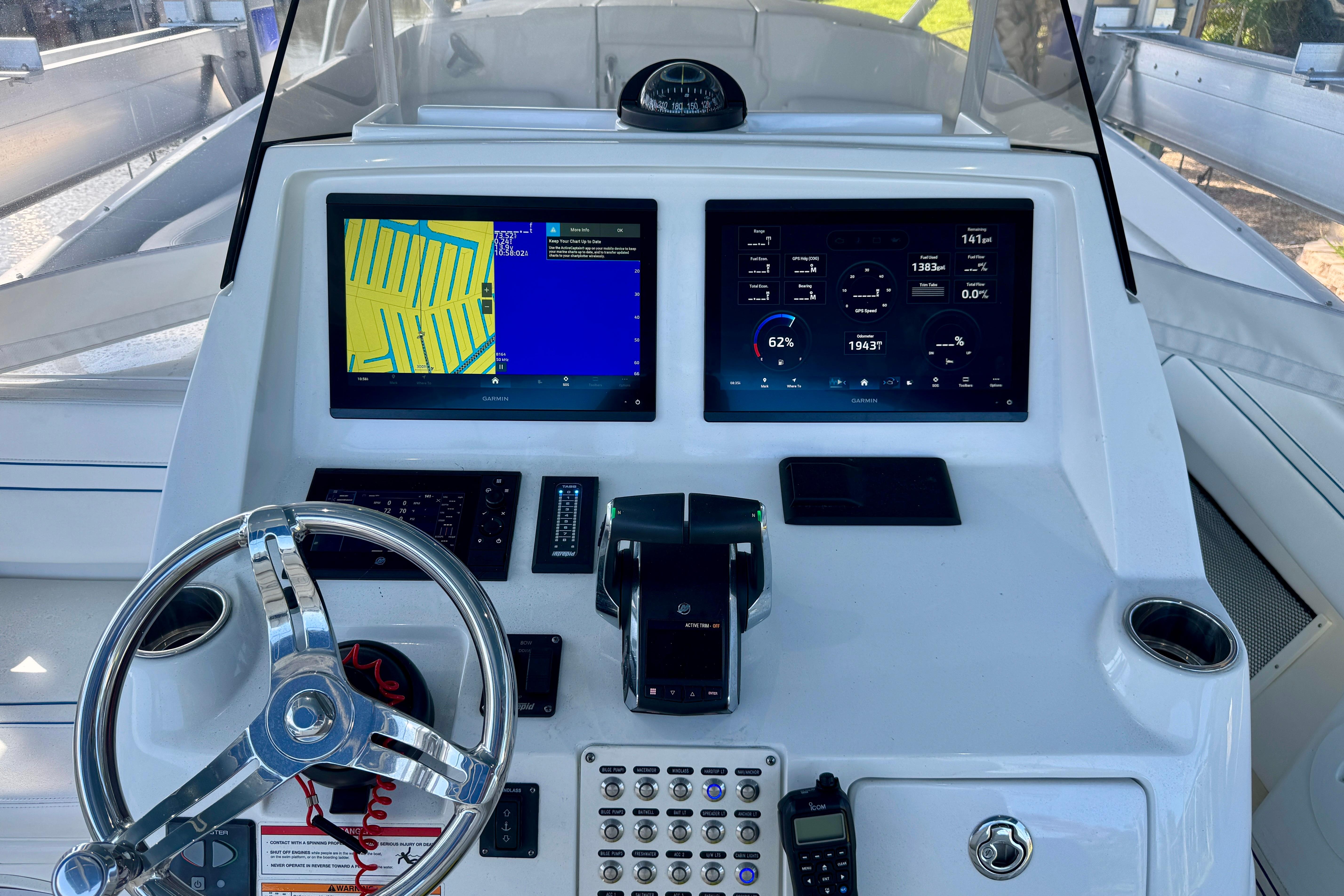 2025 Intrepid 327 Cuddy helm with dual displays and modern controls.
