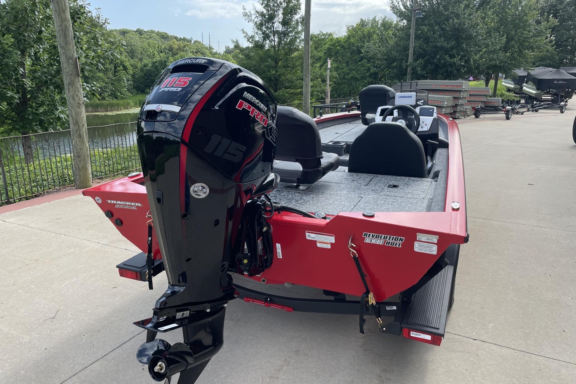 2026 Tracker Pro Team 190 boat with Mercury 115 engine, parked outdoors.