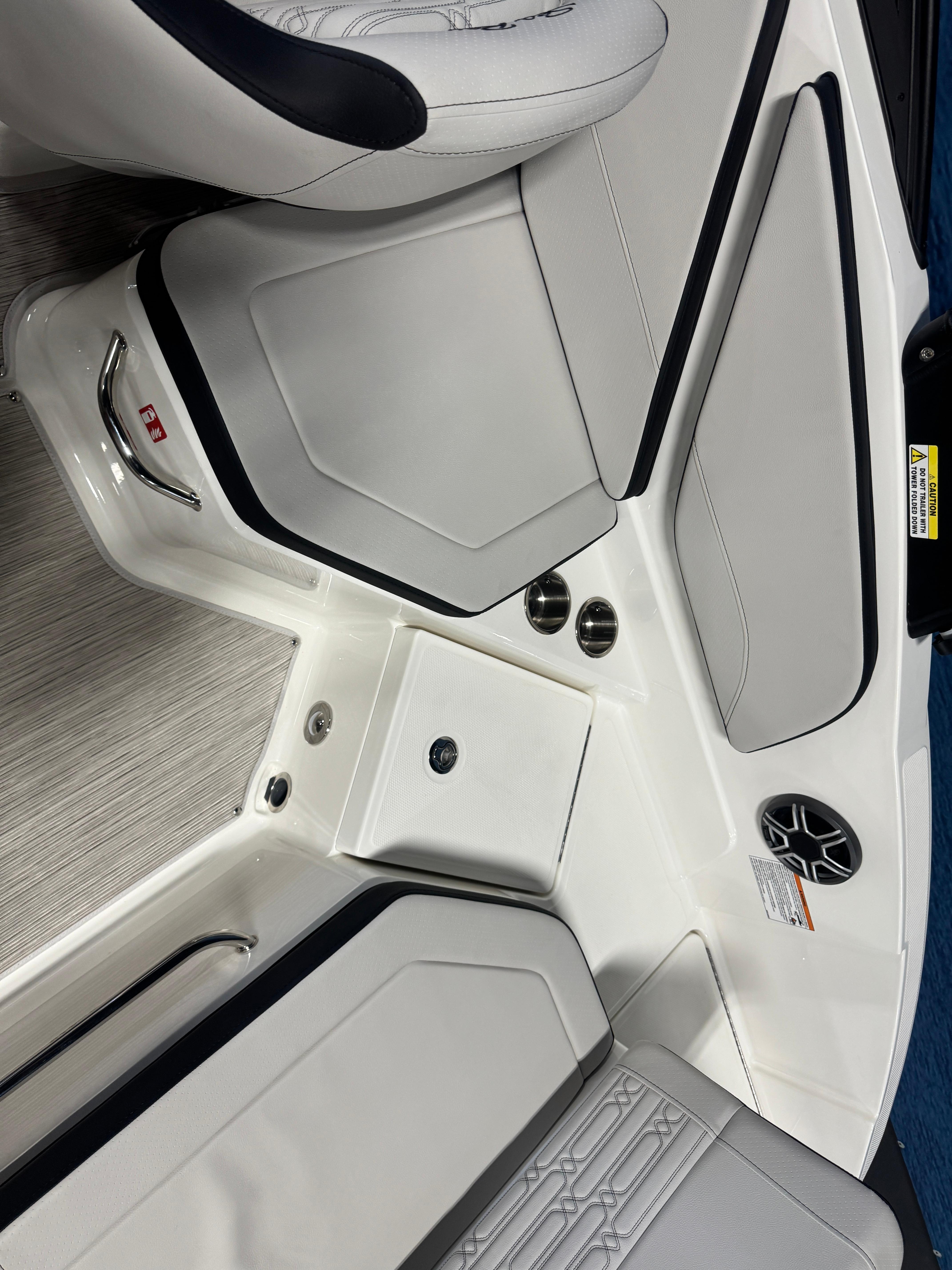 Interior of 2026 Sea Ray SPX 210 boat with white seating and modern design.
