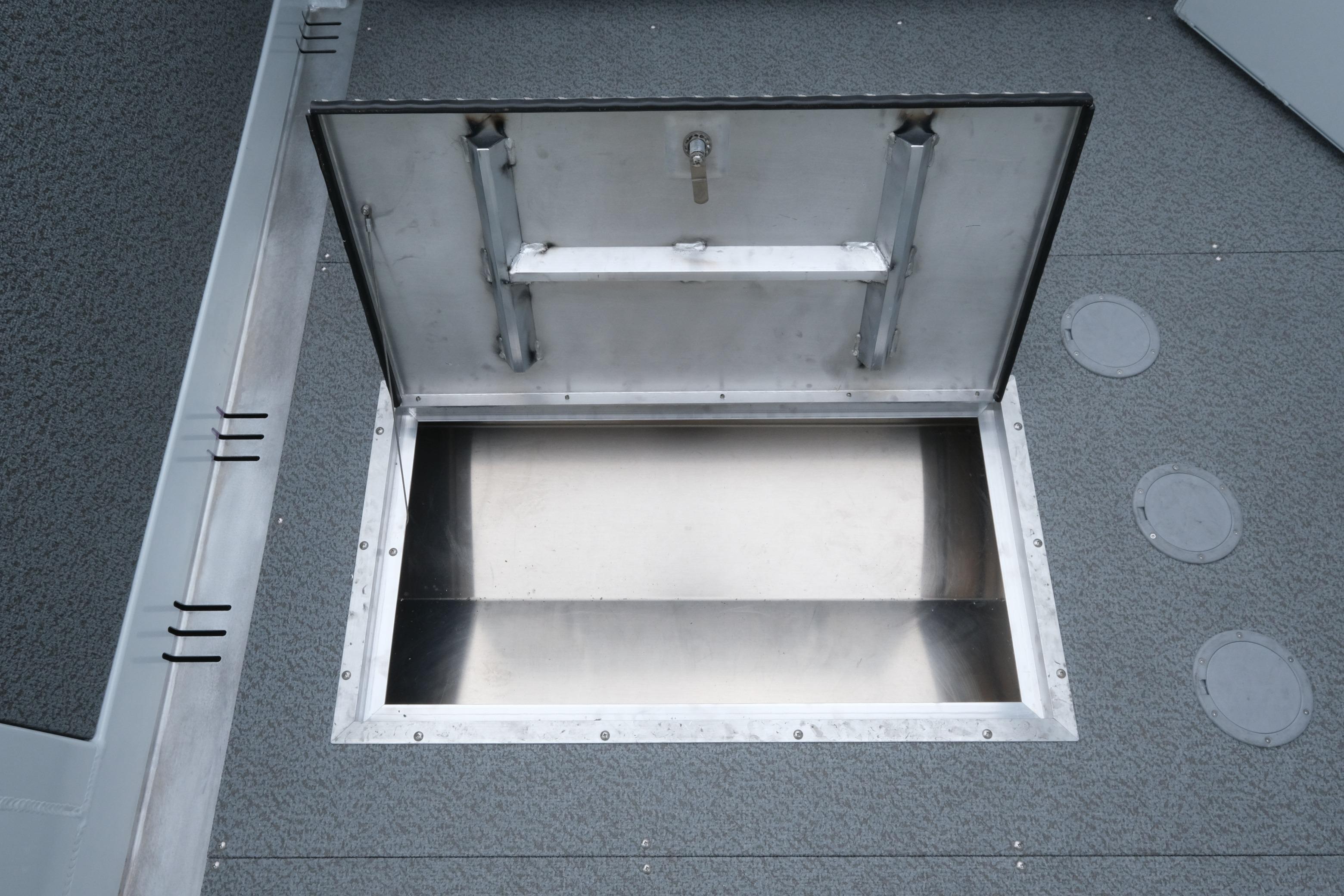 Open storage compartment on 2026 Hewescraft 210 Sea Runner ET Hardtop boat.