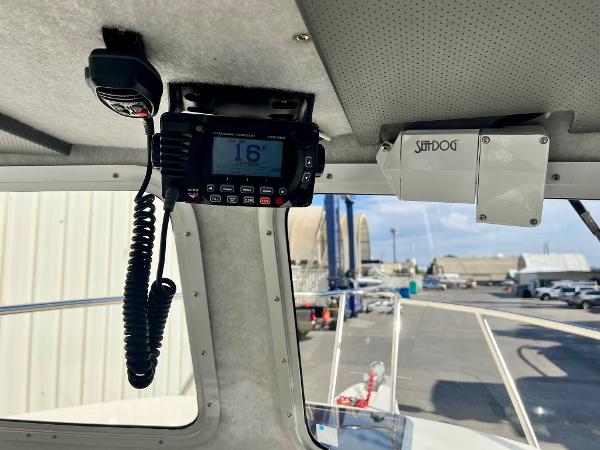Interior view of 2023 Defiance Admiral 220 EX boat with radio equipment.