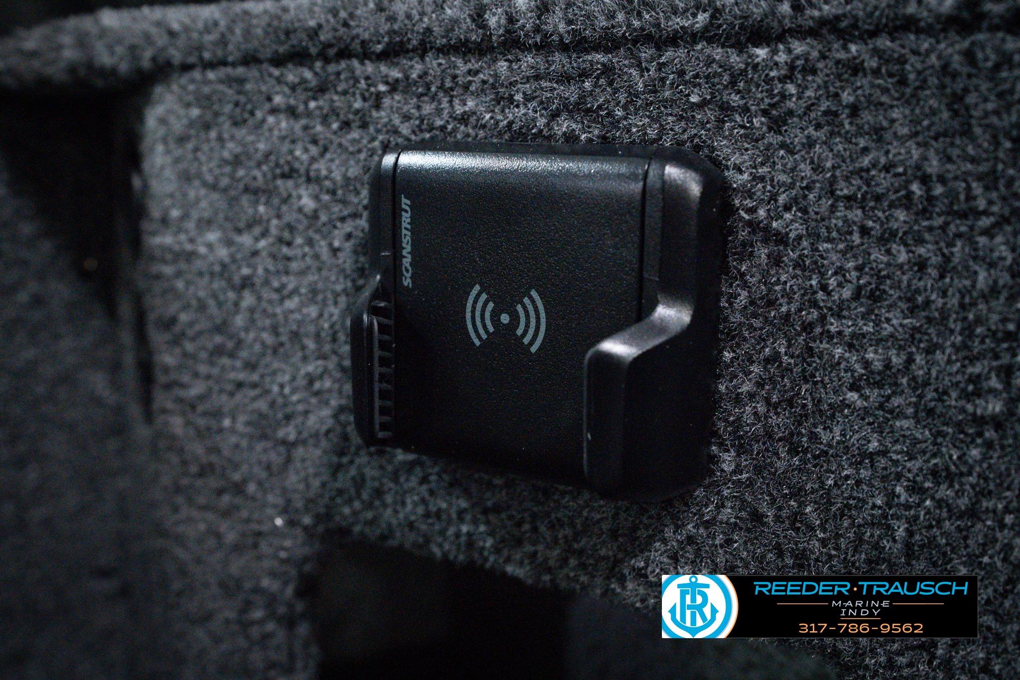 Close-up of a Scanstrut wireless charger in a 2026 Lund 1875 Impact XS SS boat.