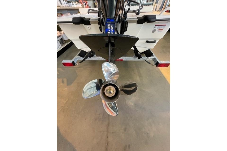 2026 Mako Pro Skiff 13 CC boat propeller and motor detail in showroom.