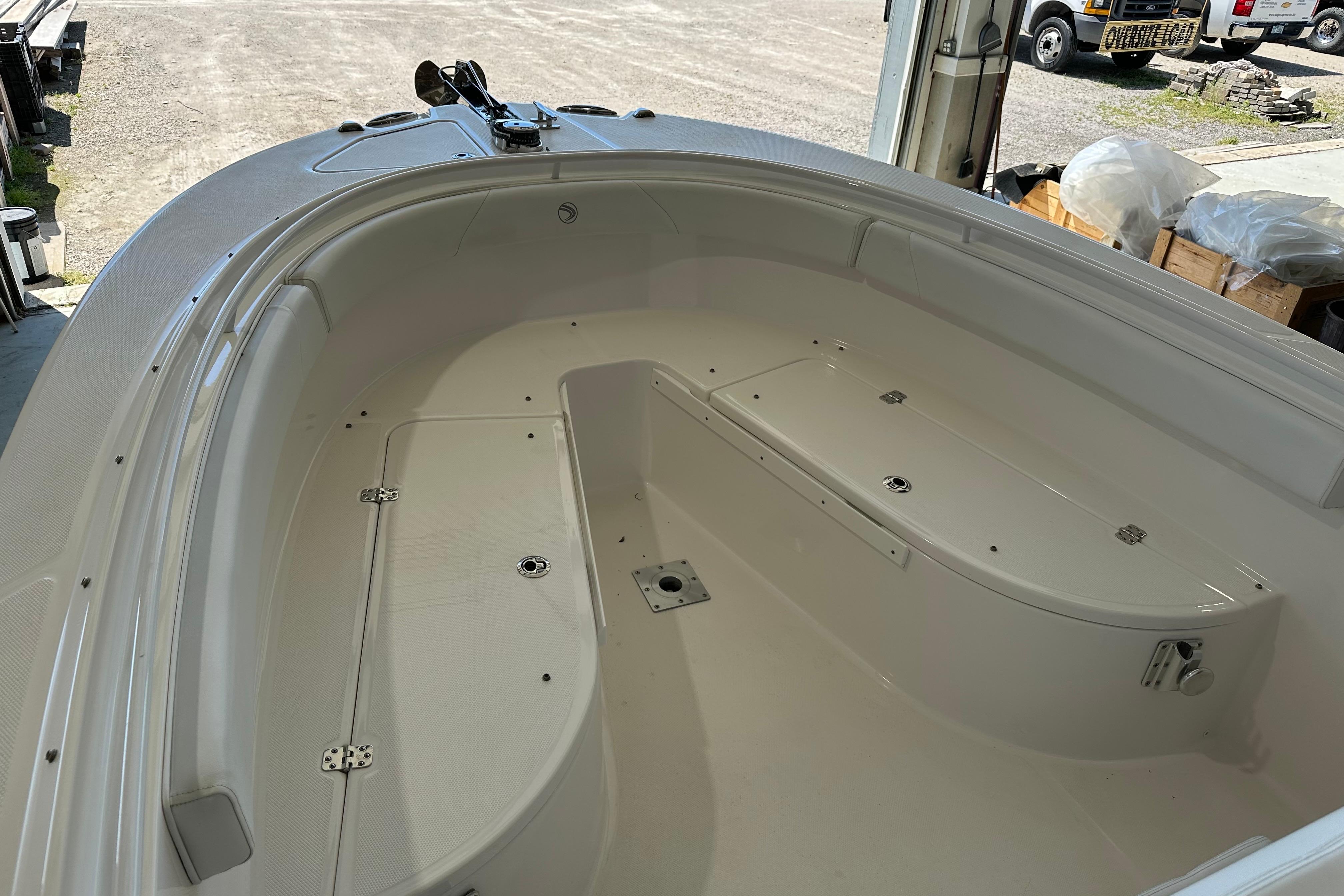 2015 Edgewater 245CC boat interior, showcasing spacious seating and storage compartments.