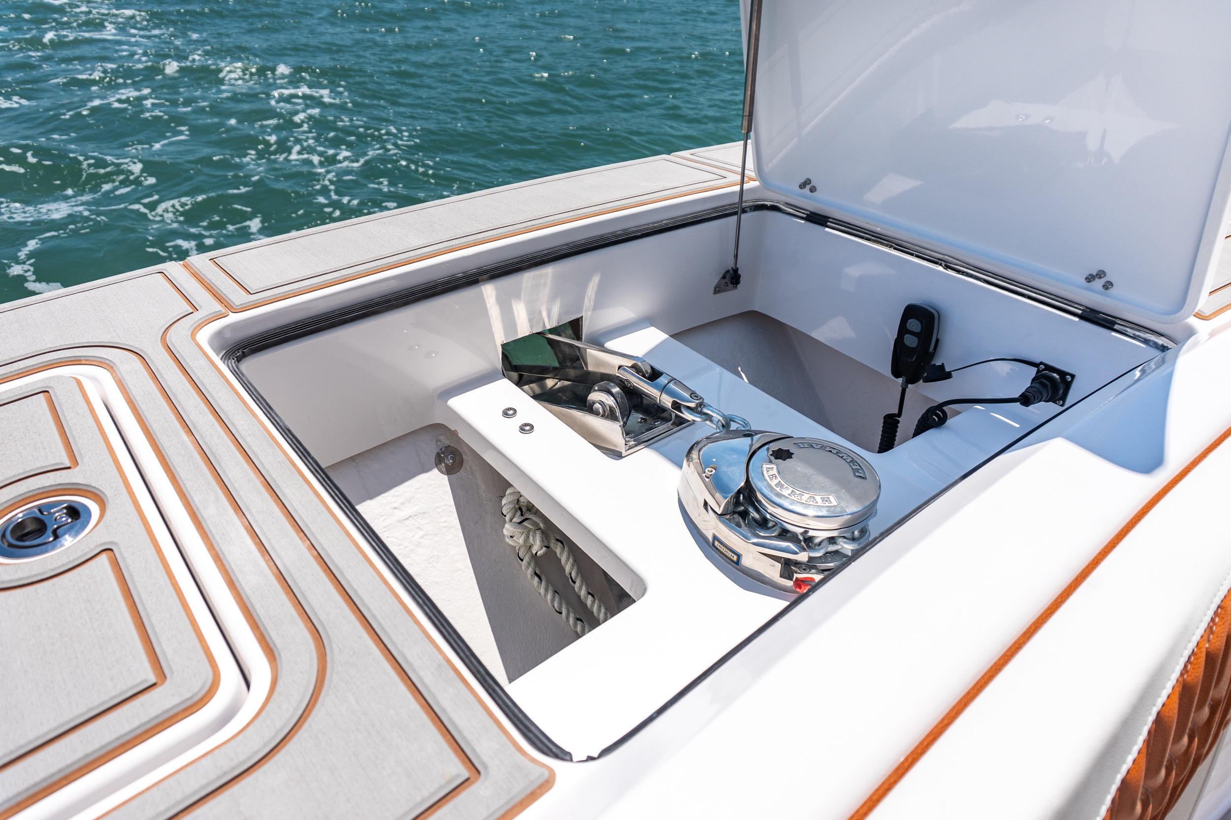 Open hatch on 2026 Twin Vee 400 GFX2 CC boat, revealing anchor storage.