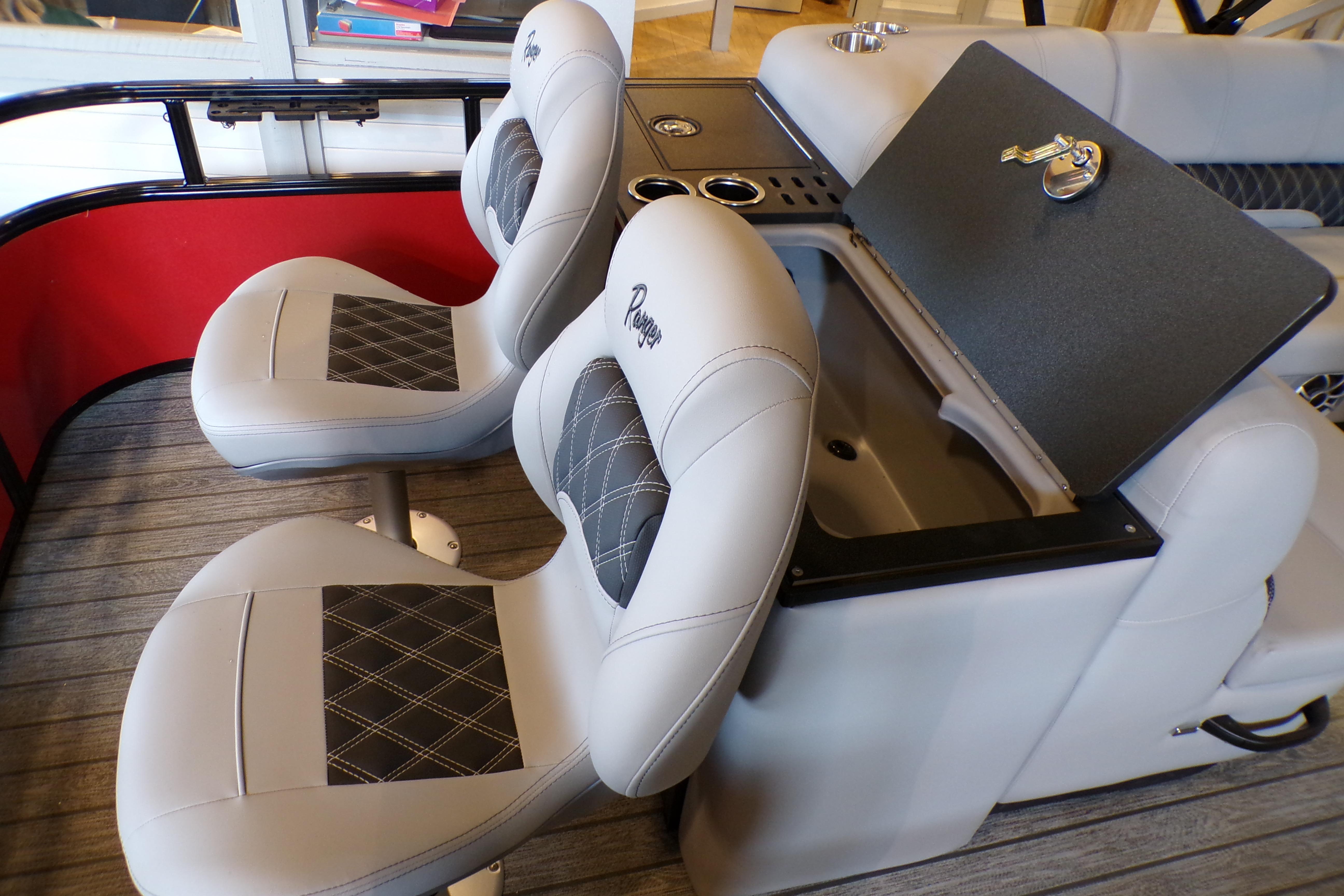 2026 Ranger 220FC boat interior with cushioned seats and storage compartment.