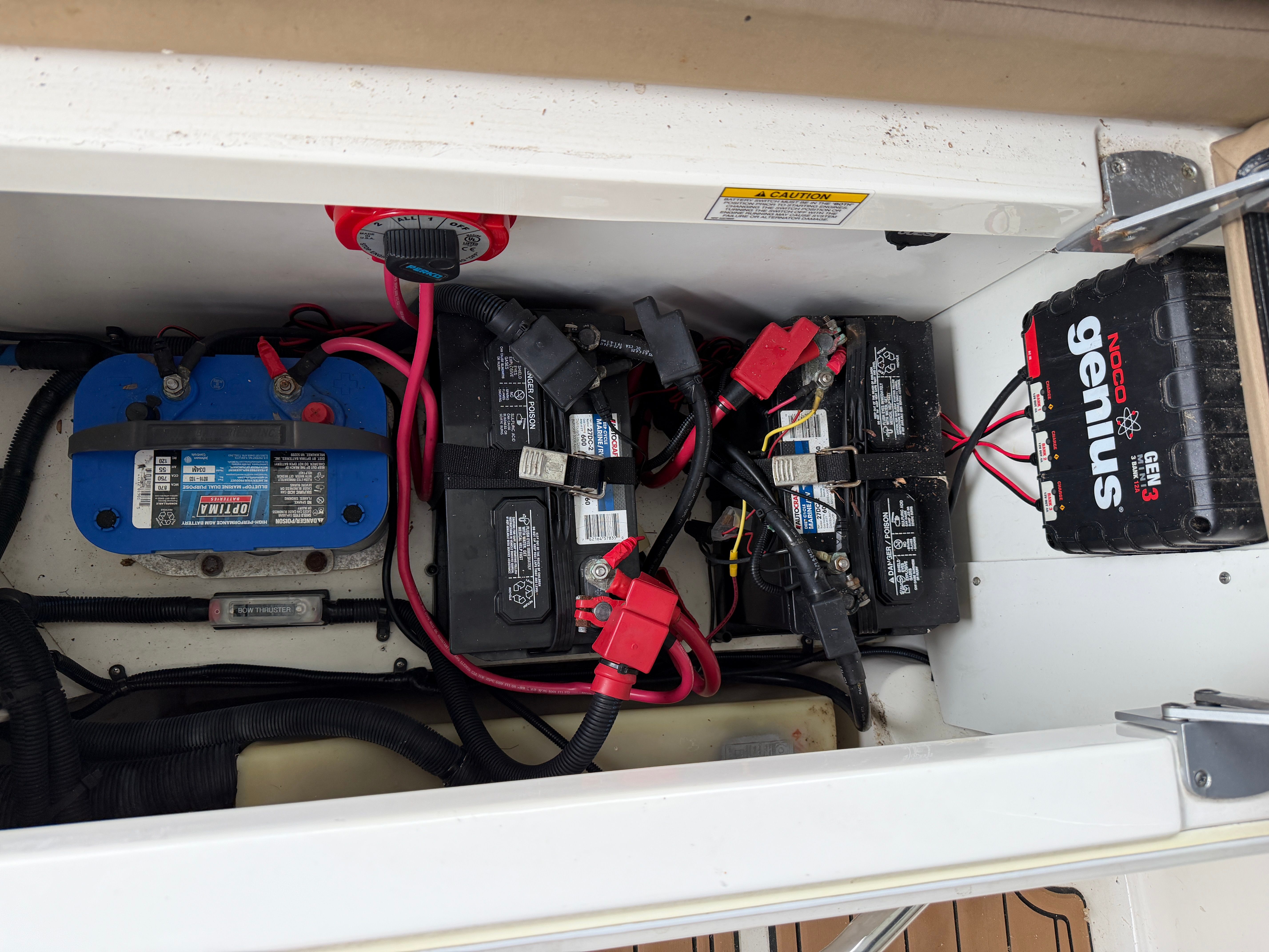 Battery compartment of a 2016 Sea Ray 290 Sundeck boat with NOCO Genius charger.