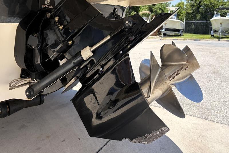 Close-up of a 2007 Sea Ray 240 Sundeck boat propeller and outdrive.