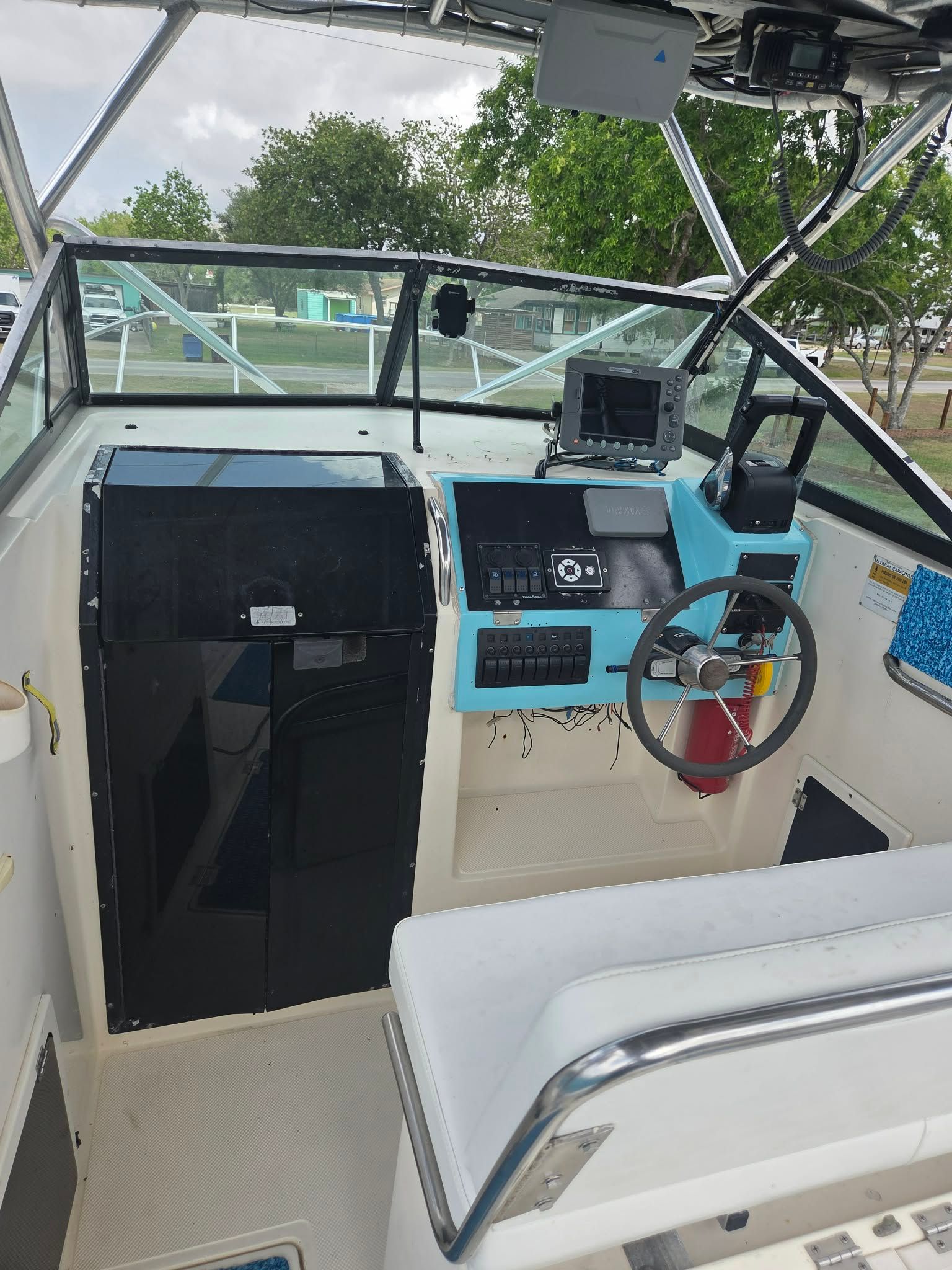 Interior view of a 1997 Sea Cat SLC 5 boat cockpit with controls.