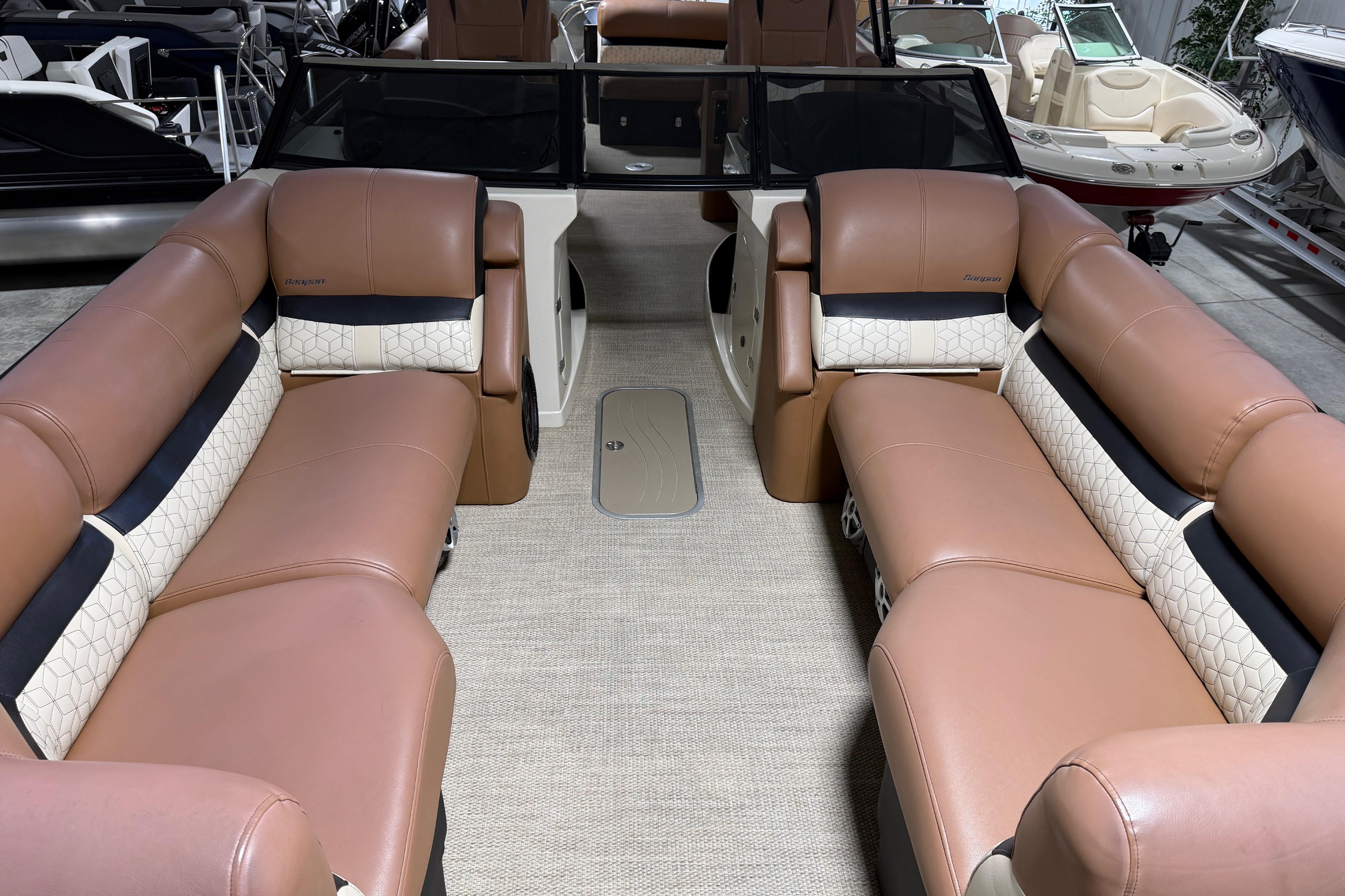 2018 Godfrey Sanpan 2500 ULC pontoon boat interior with luxurious tan seating.