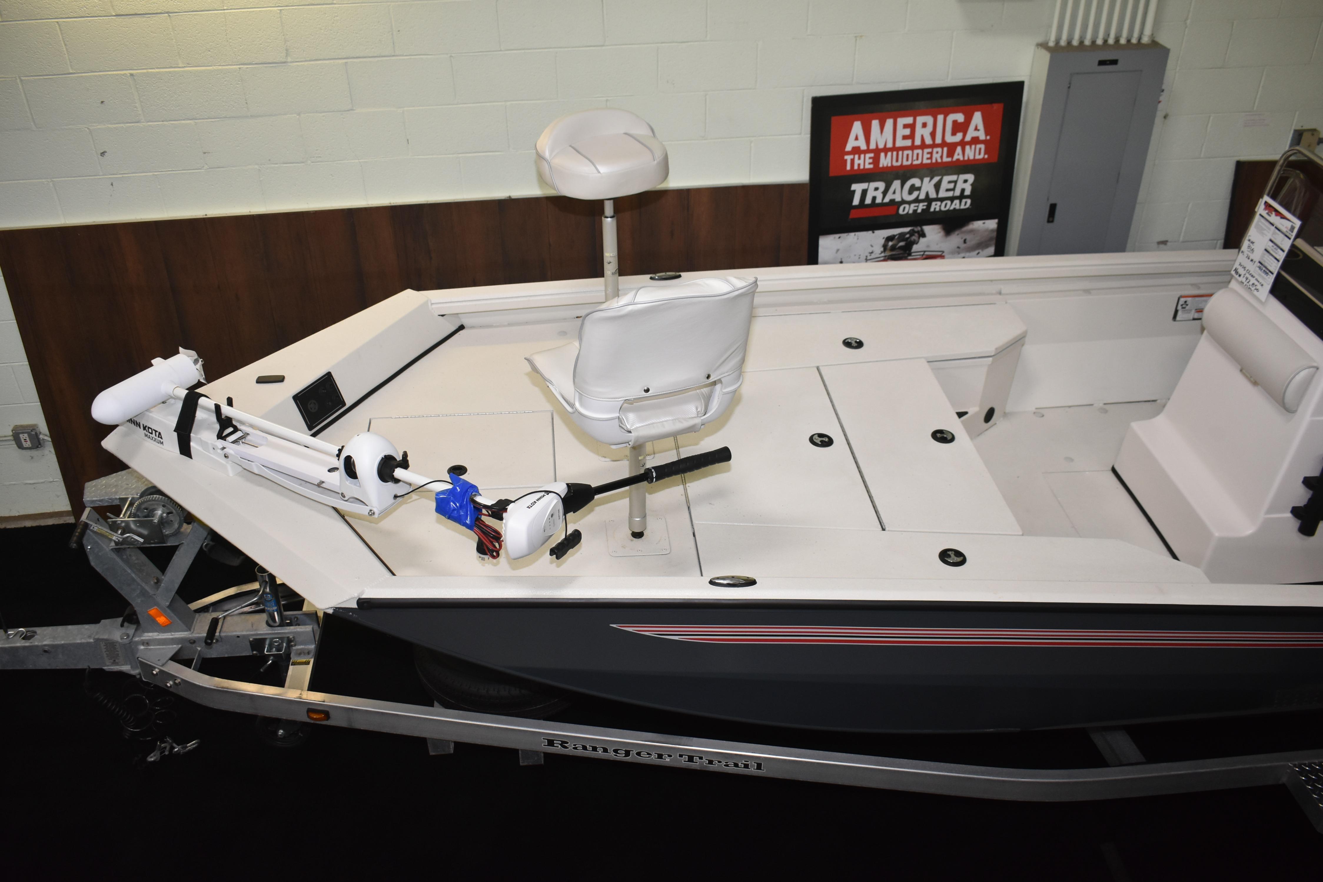 2024 Ranger RB200 boat interior with seating and trolling motor, displayed indoors.