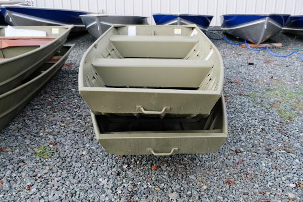 2024 Crestliner 1436L CR Jon boat on gravel lot, front view.