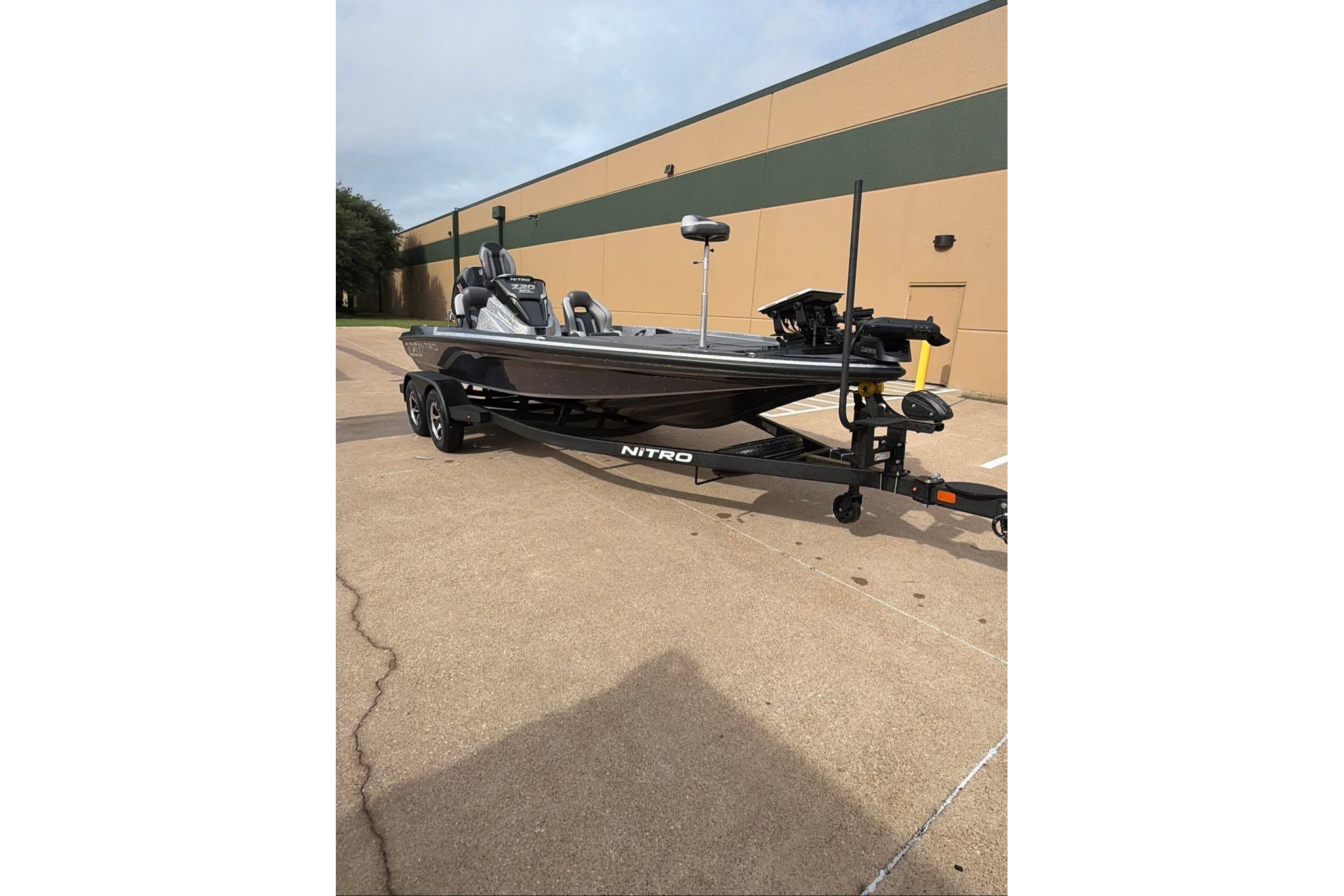 2026 Nitro Z20 XL boat on trailer, parked outdoors near a building.