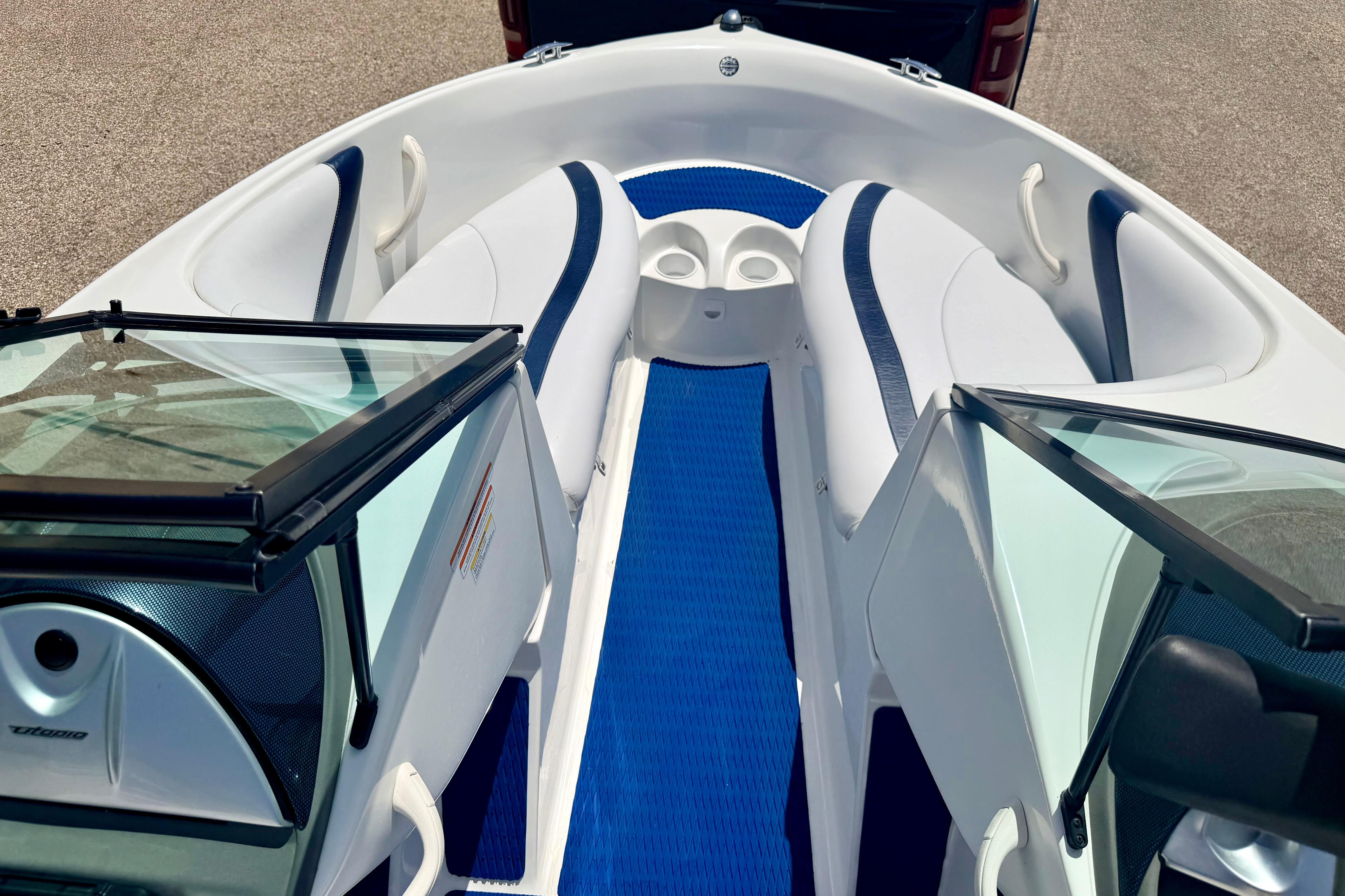 2004 Bombardier SEADOO Utopia 185 boat interior with blue and white seating.