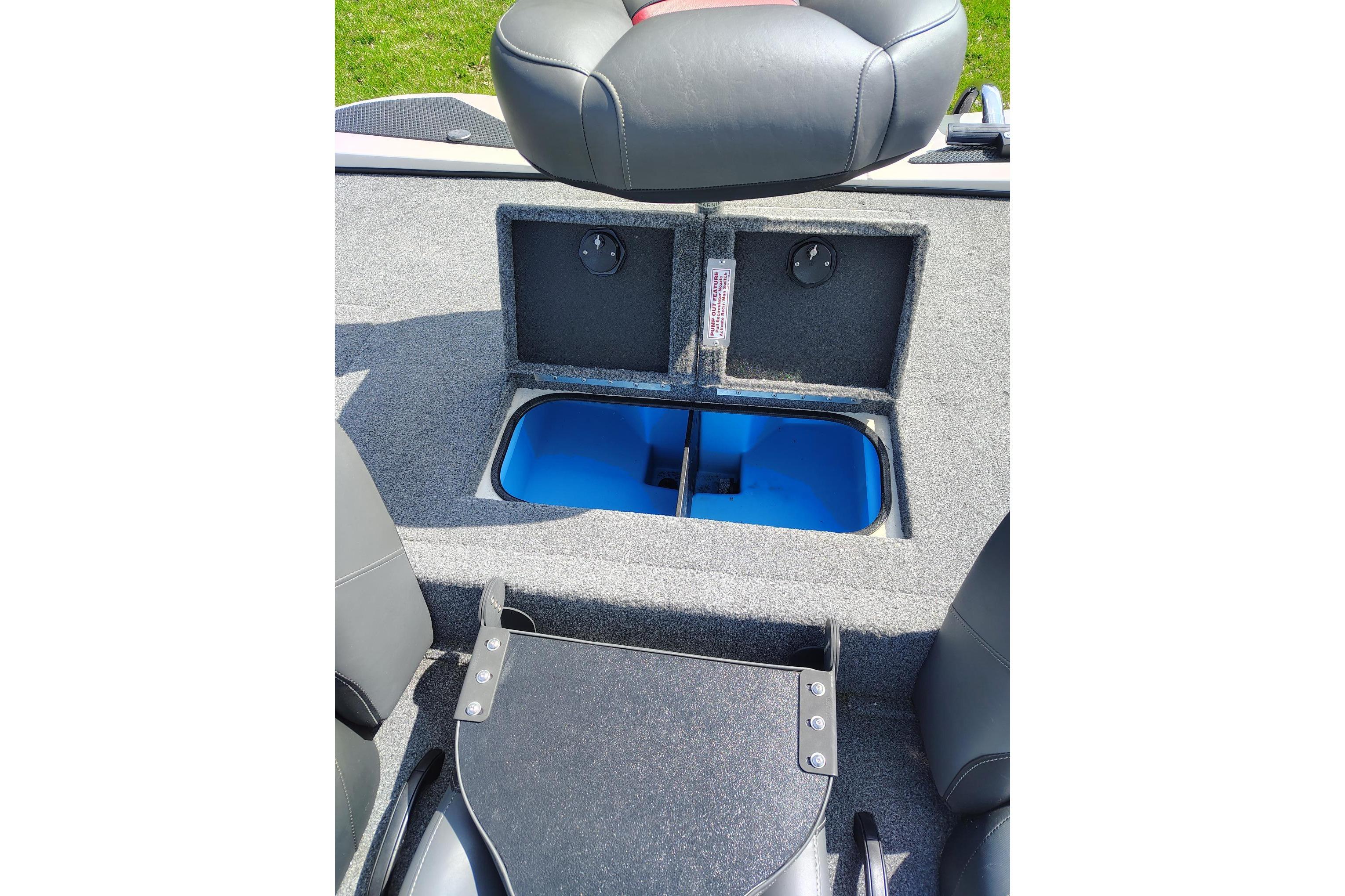 2025 Tracker Savage 215 boat interior with open storage compartment and seating.