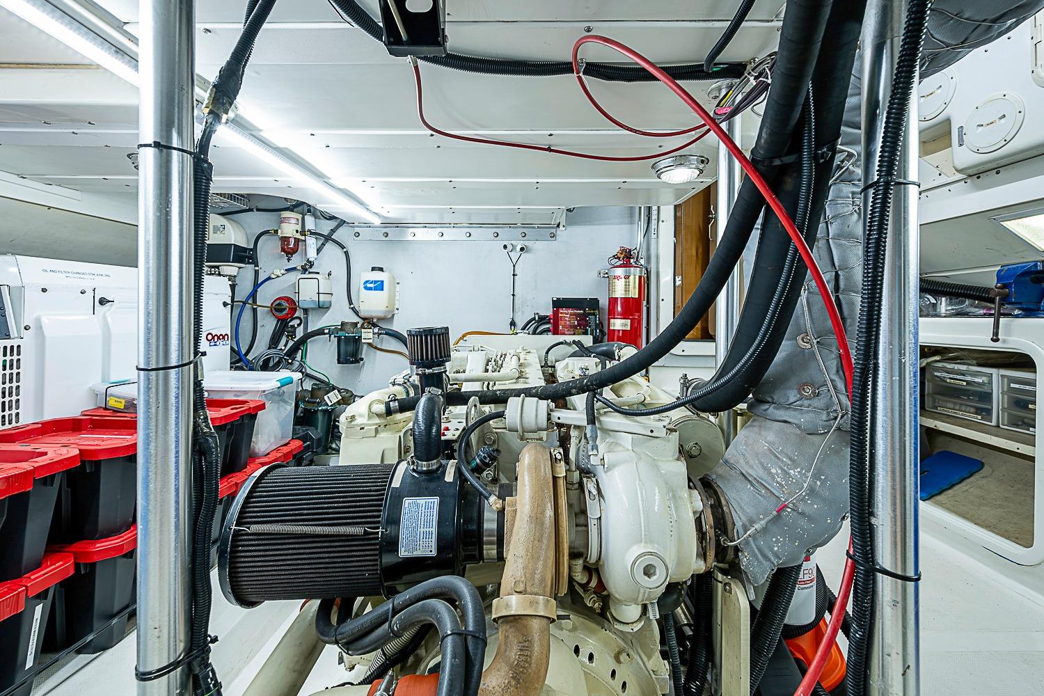 Engine room of 2003 Magna Marine Nova Scotia 47, featuring organized equipment and storage.