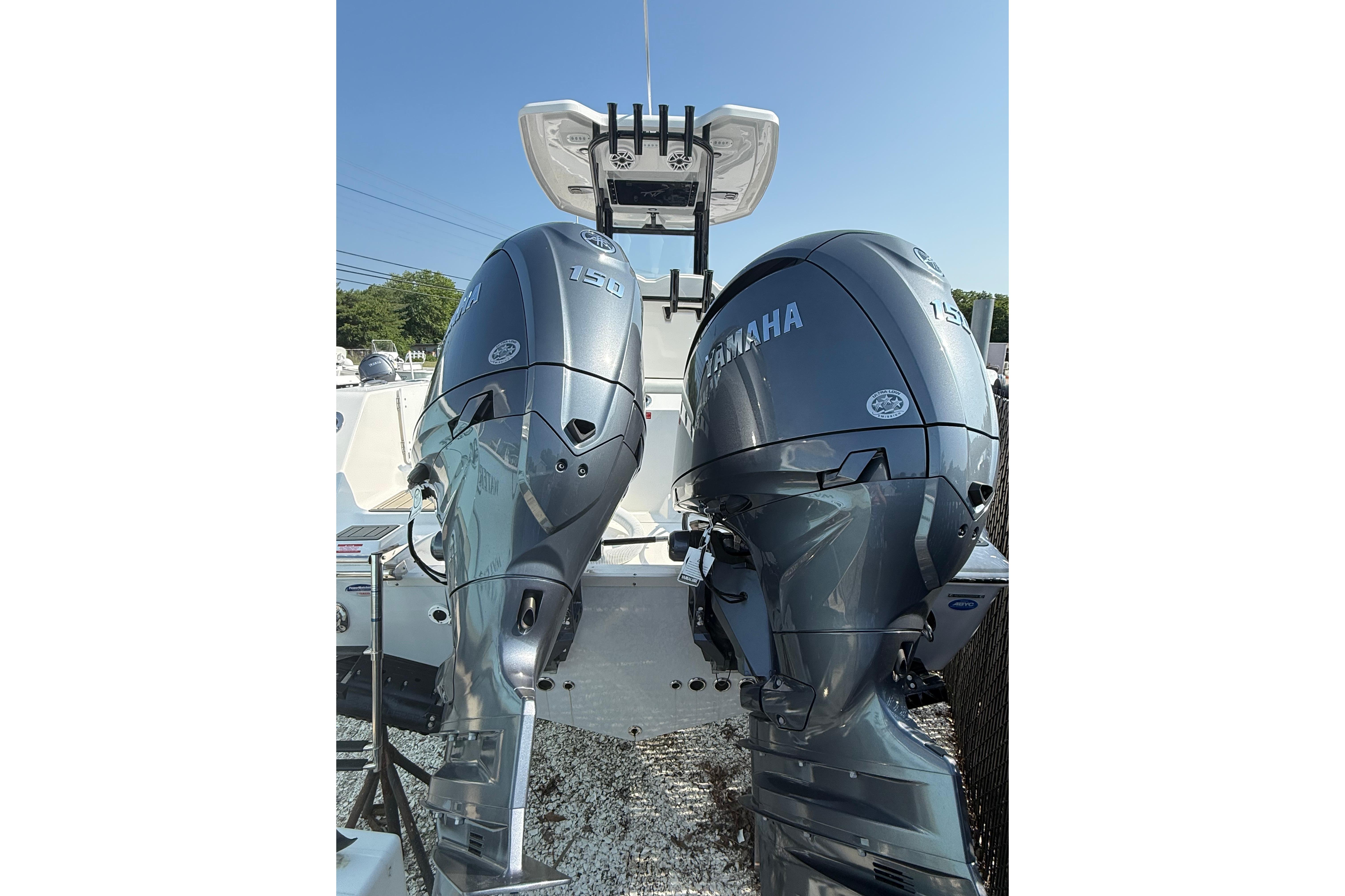2026 Tidewater 256 CC Adventure boat with dual Yamaha 150 outboard engines.