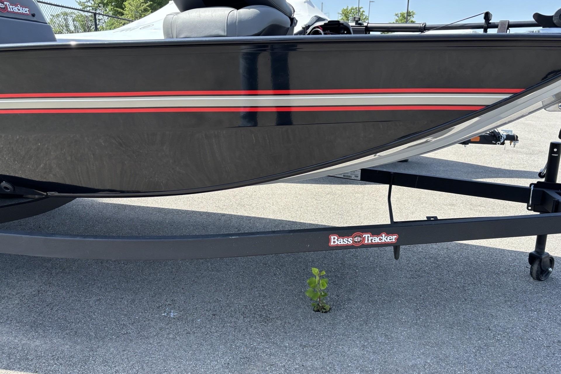 2026 Tracker Bass Tracker Classic XL boat on trailer, parked on pavement.