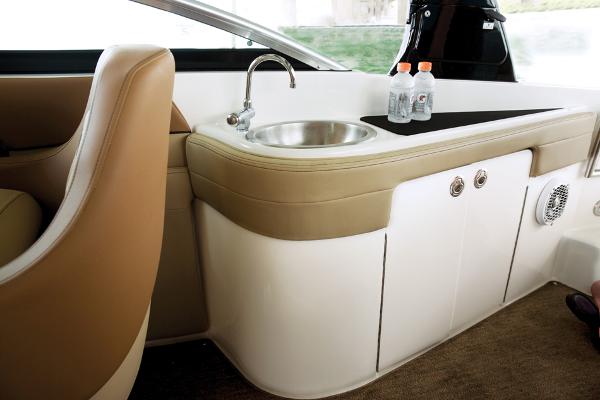 Manufacturer Provided Image: Interior of 2014 Sea Ray 260 Sundeck with sink and storage compartments.