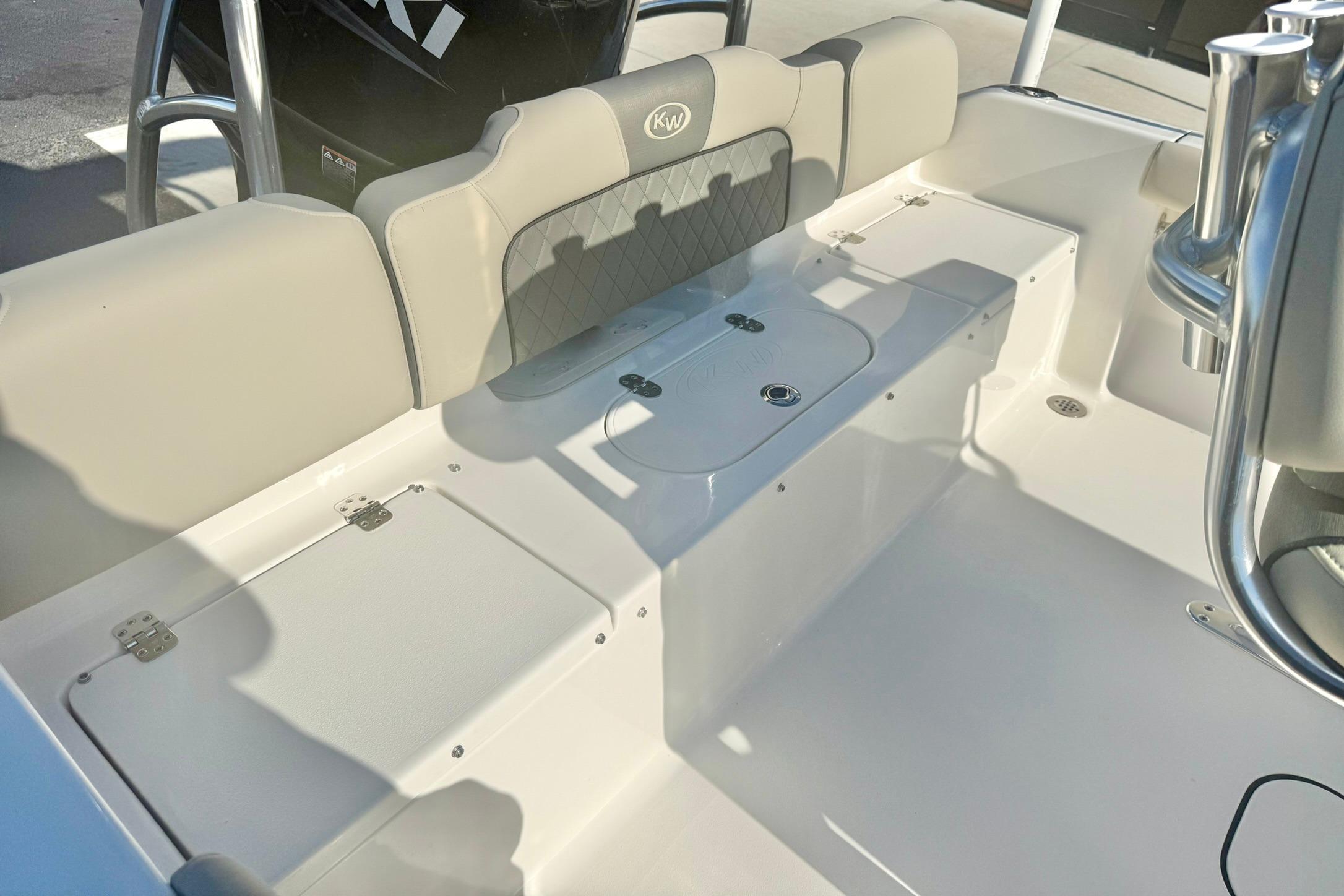 2026 Key West 189 FS boat interior with cushioned seating and storage compartments.