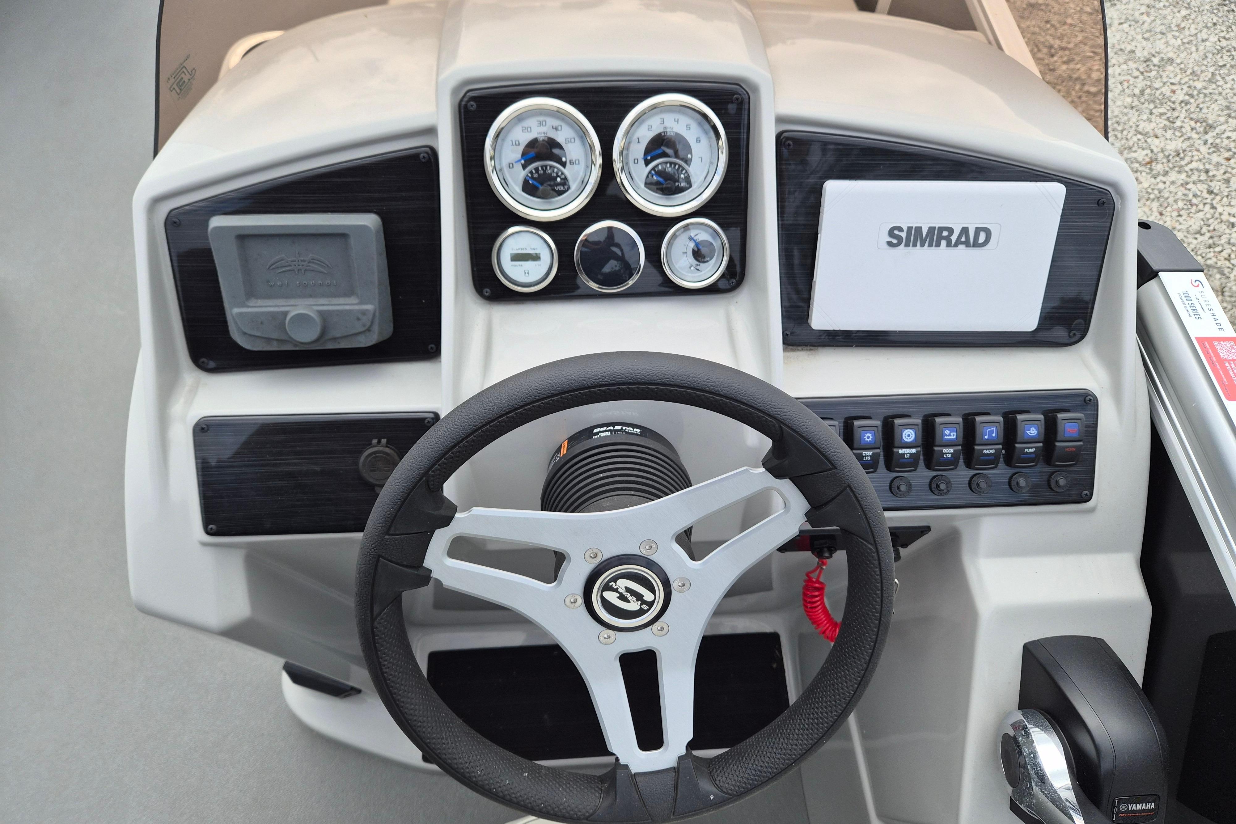 Steering console of 2025 Sylvan Mirage Fish 8522 Party Fish 4.0 with Simrad display.