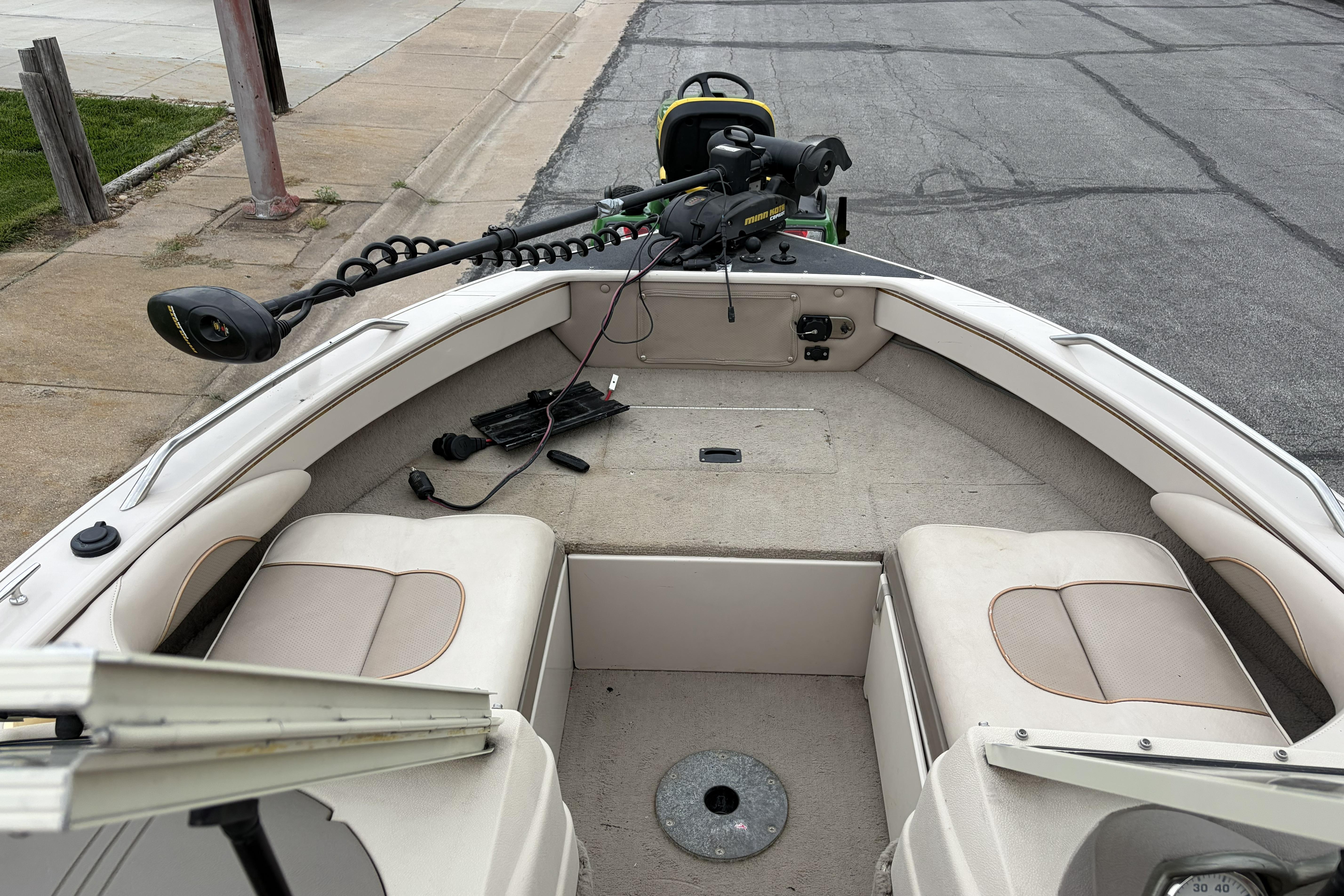 2002 Crestliner 1850 Sportfish boat interior with seating and trolling motor.