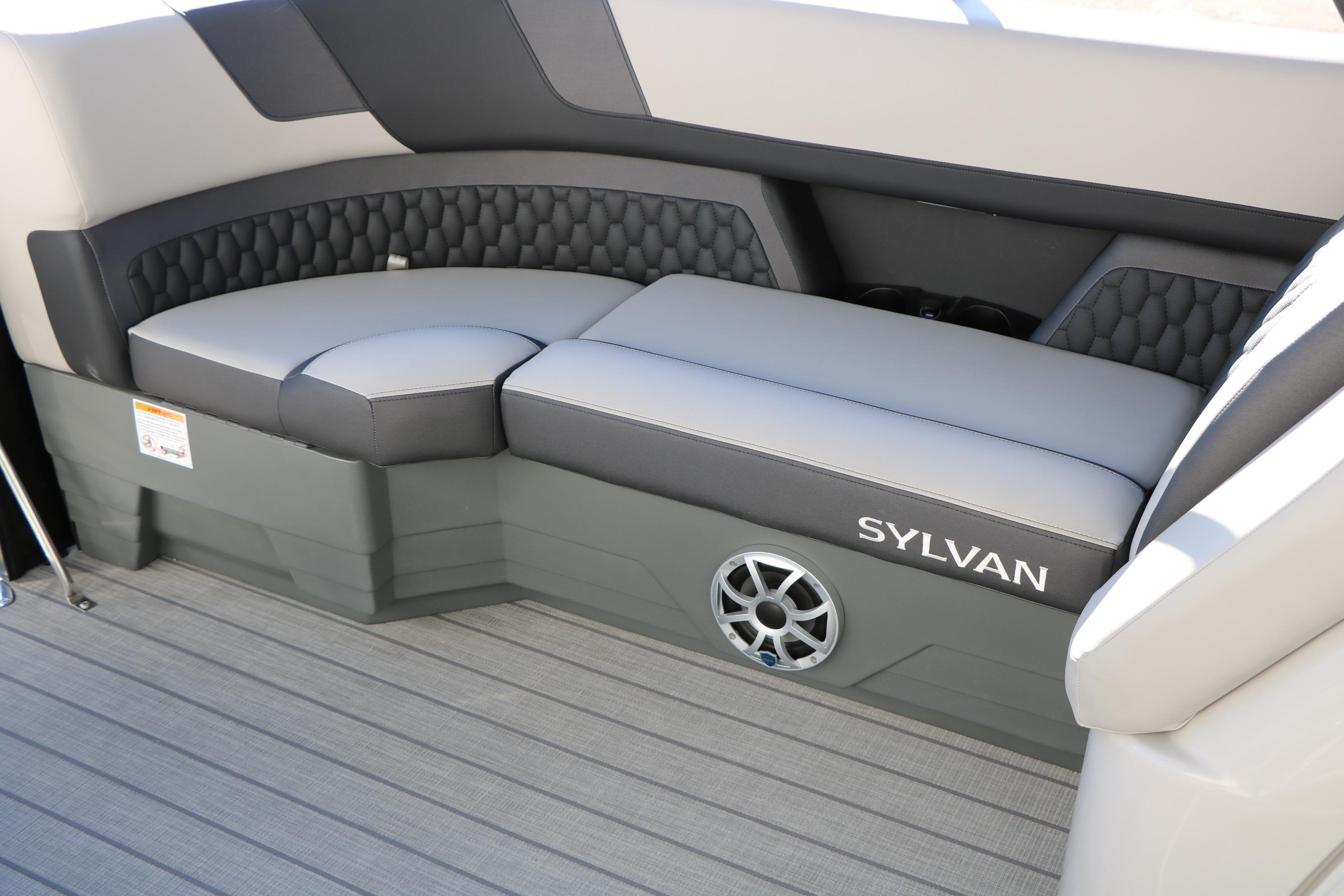 2026 Sylvan L3 CLZ DH boat interior with stylish seating and speaker system.
