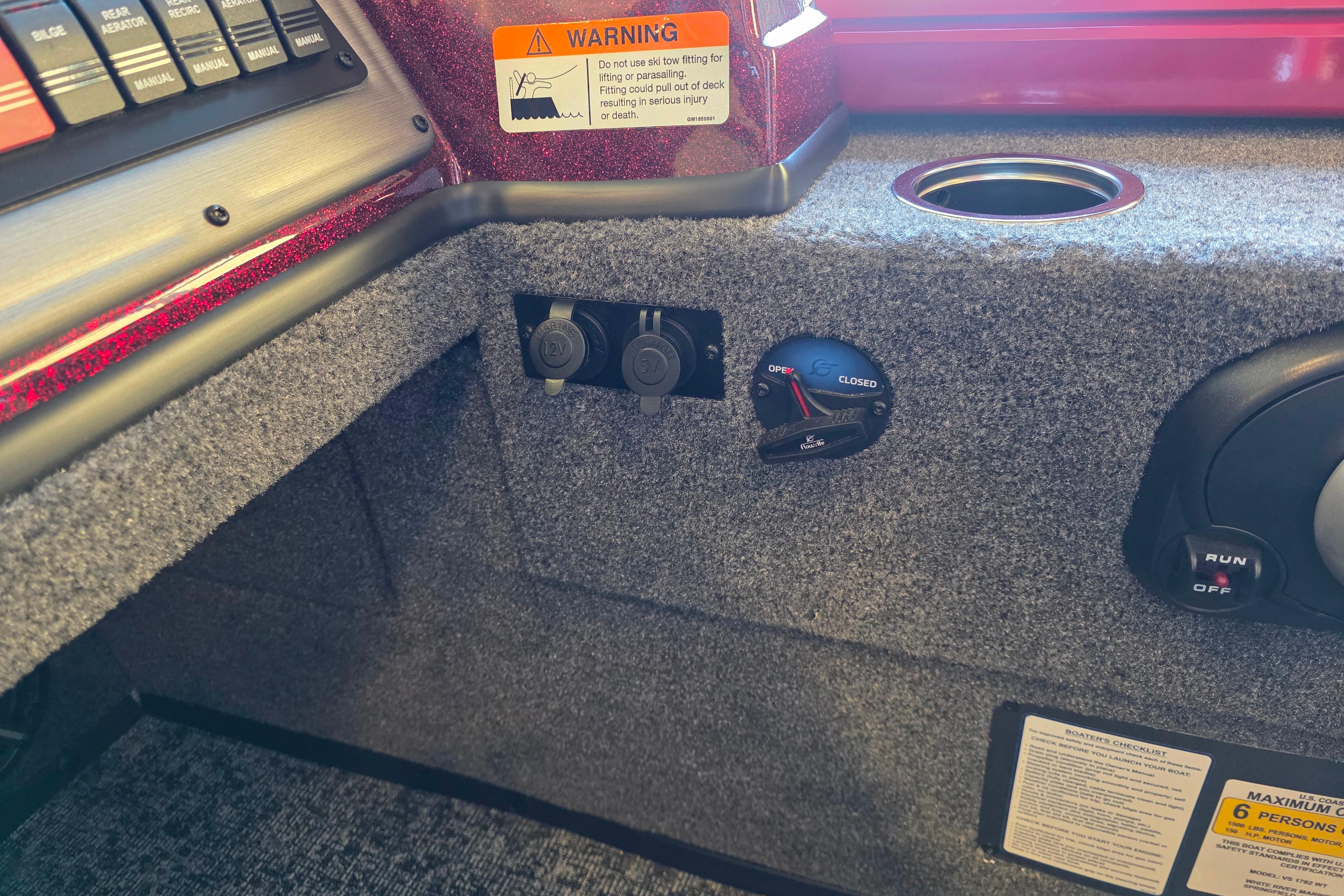 Interior of 2026 Ranger VS1782SC Reata boat with control panel and warning label.