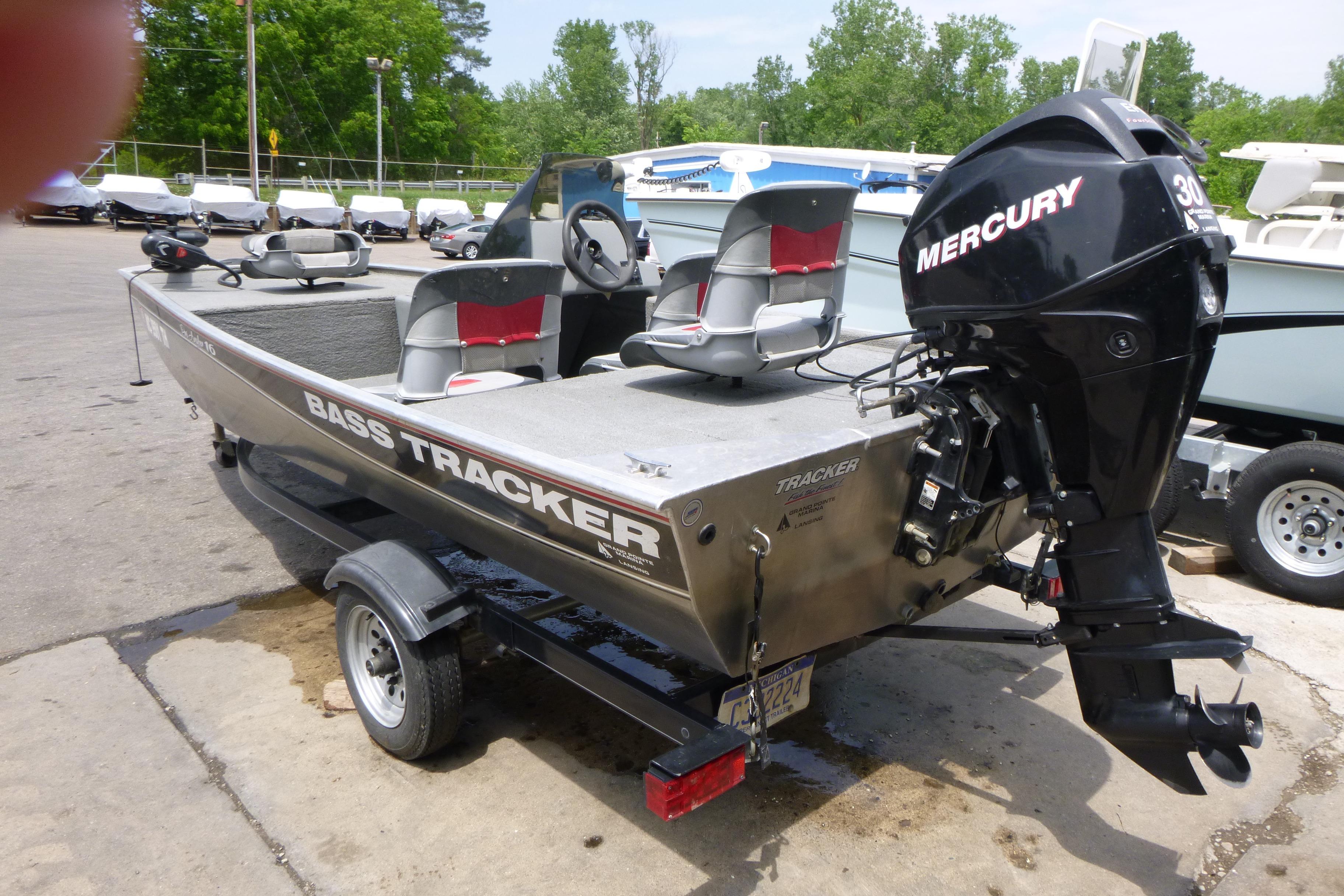 2011 Tracker Pro Angler 16 boat with Mercury engine, parked on a trailer.