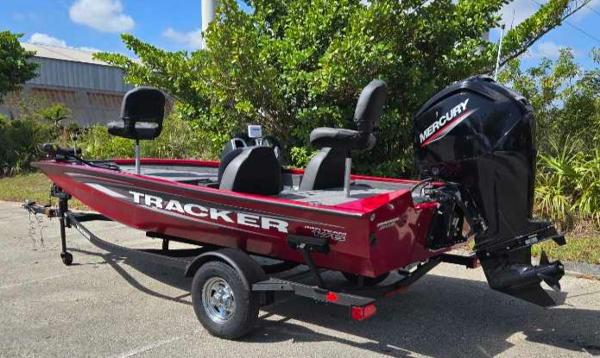 2025 Tracker Pro Team 175 boat with Mercury engine, parked outdoors.