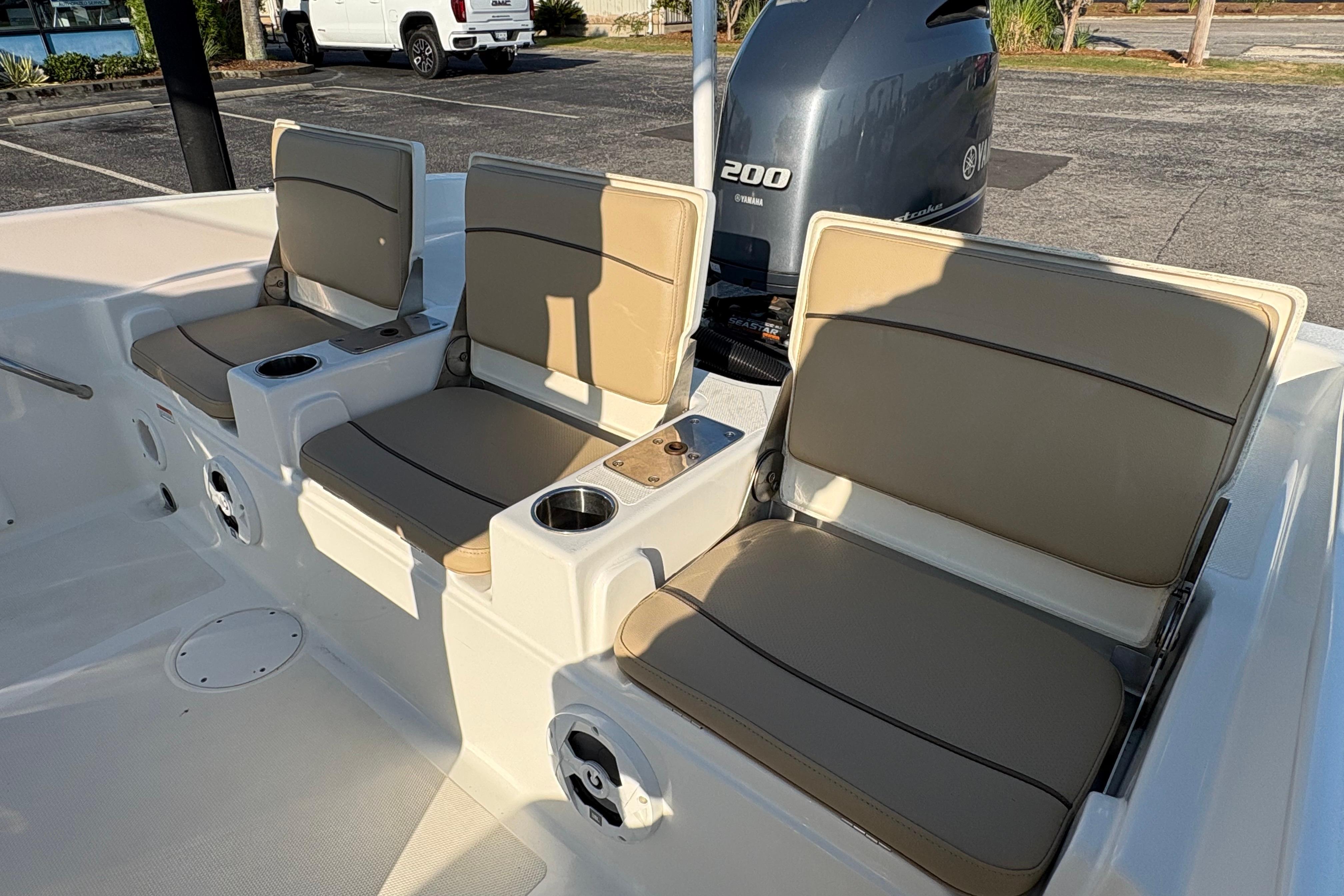 2019 NauticStar 231 Hybrid boat seats with cup holders and Yamaha 200 engine.