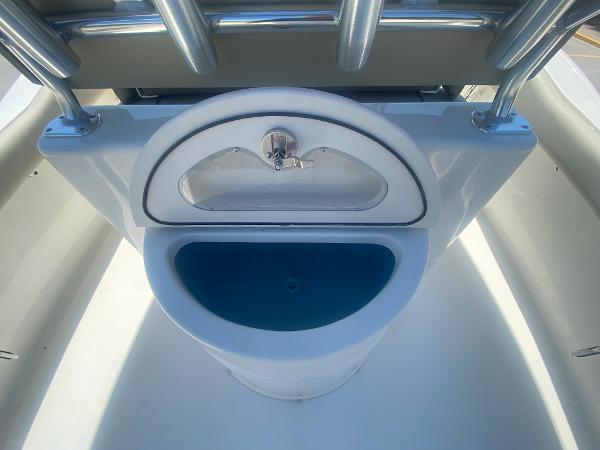2024 Key West 239 FS boat console with sink and storage compartment.