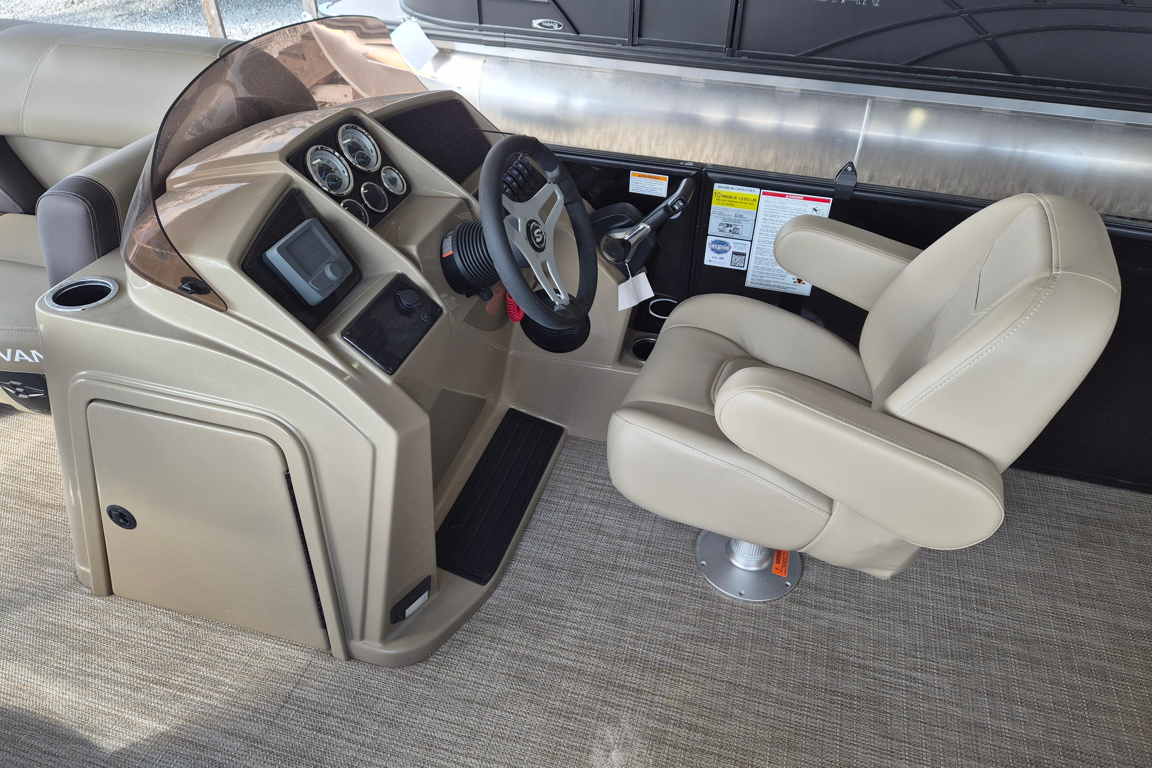 2026 Sylvan Mirage 820 CLZ DH boat helm with beige captain's chair and control panel.