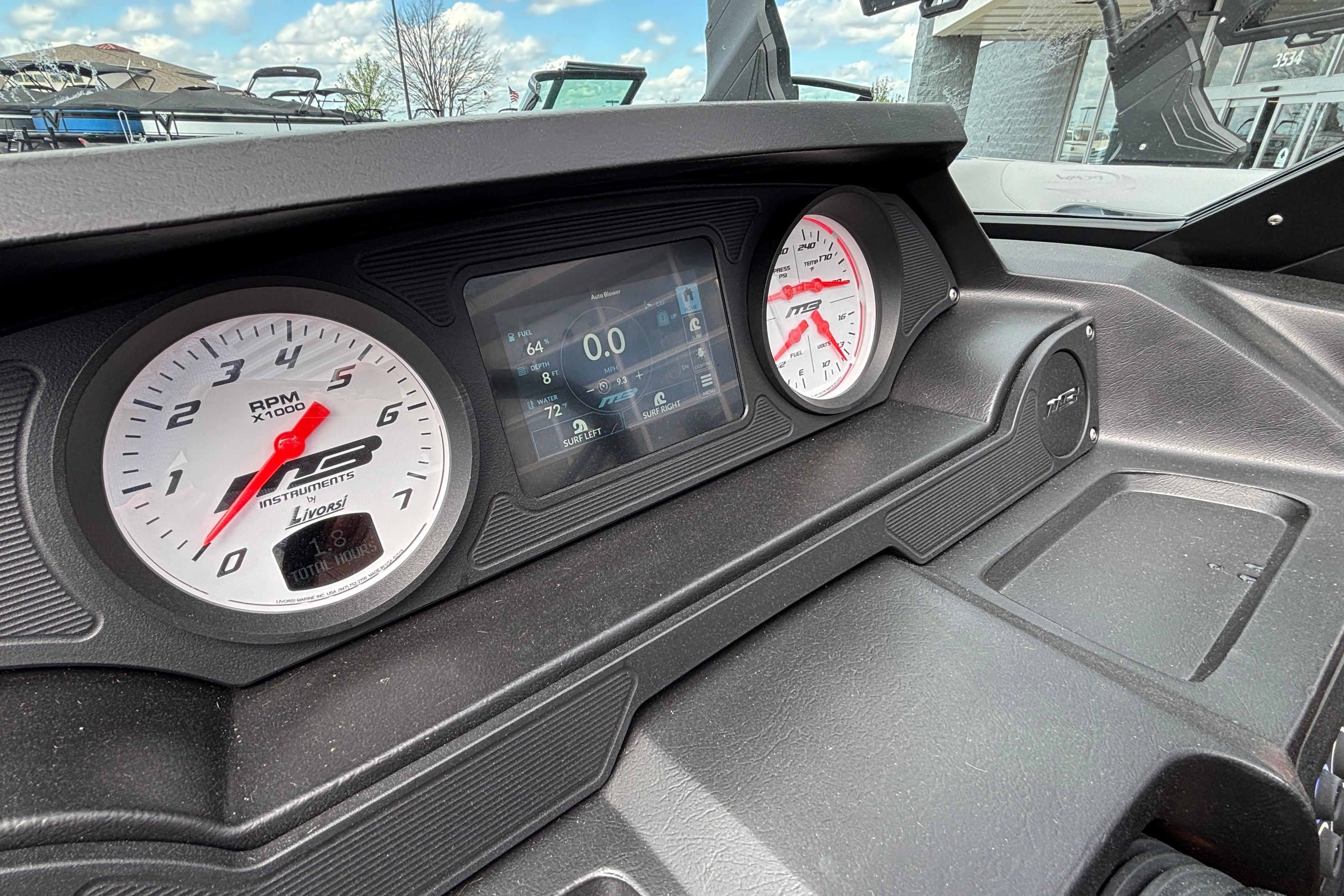 Dashboard of 2026 MB B52 23 Classic boat with RPM gauges and digital display.