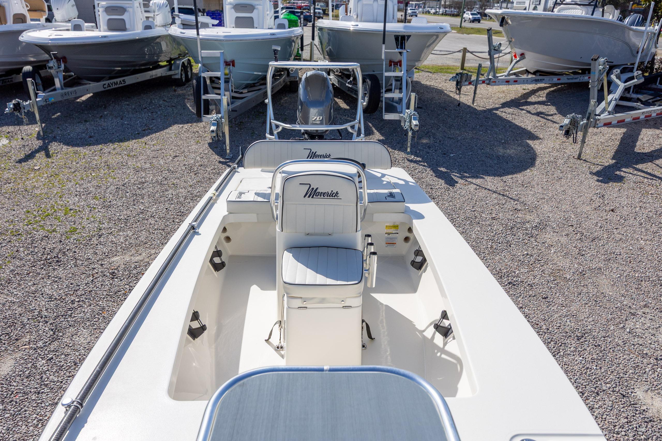 2024 Maverick 17 HPX-S boat displayed in a dealership lot, showcasing sleek design.