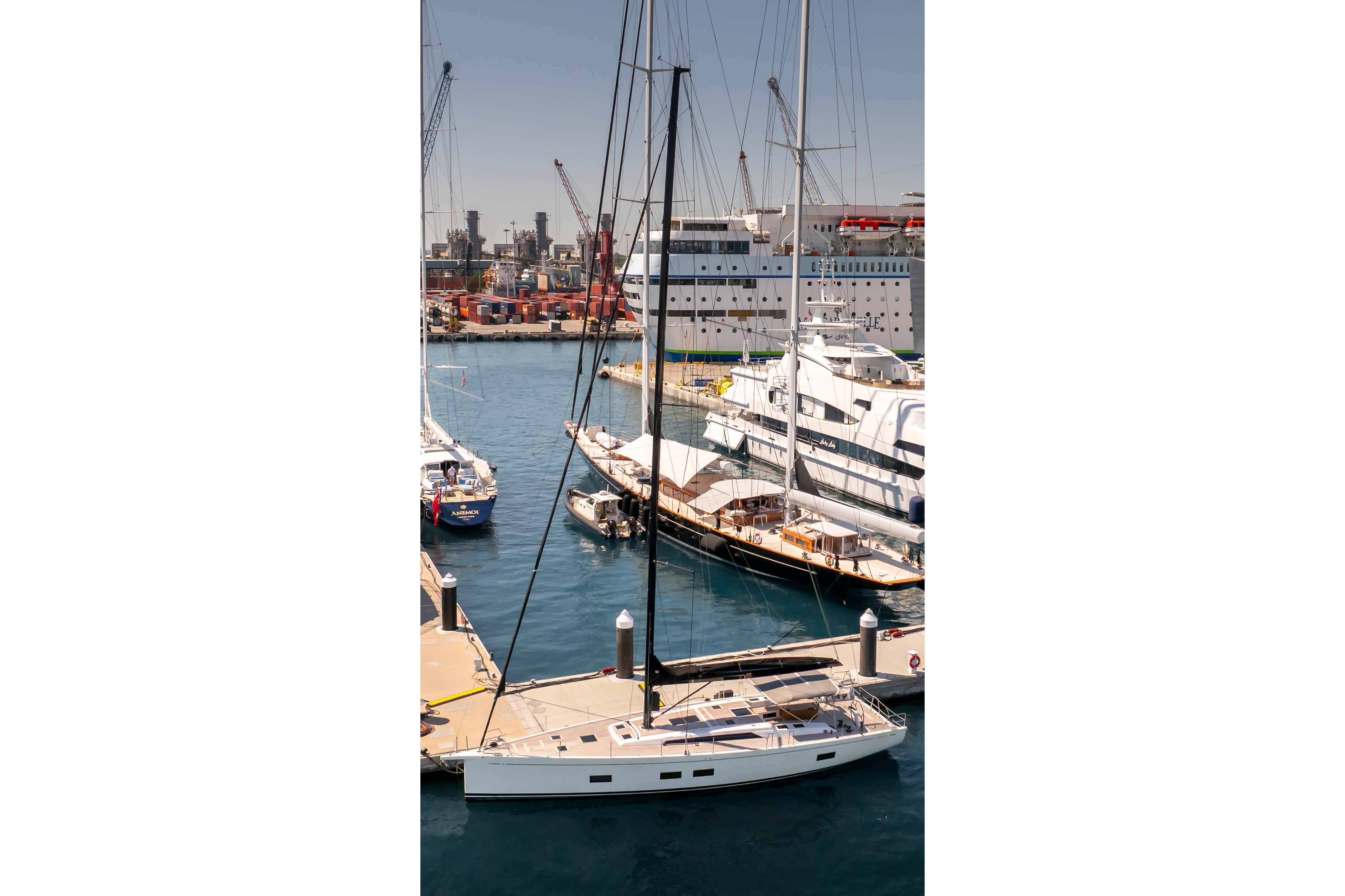 2016 Grand Soleil 58 yacht docked in a bustling marina.